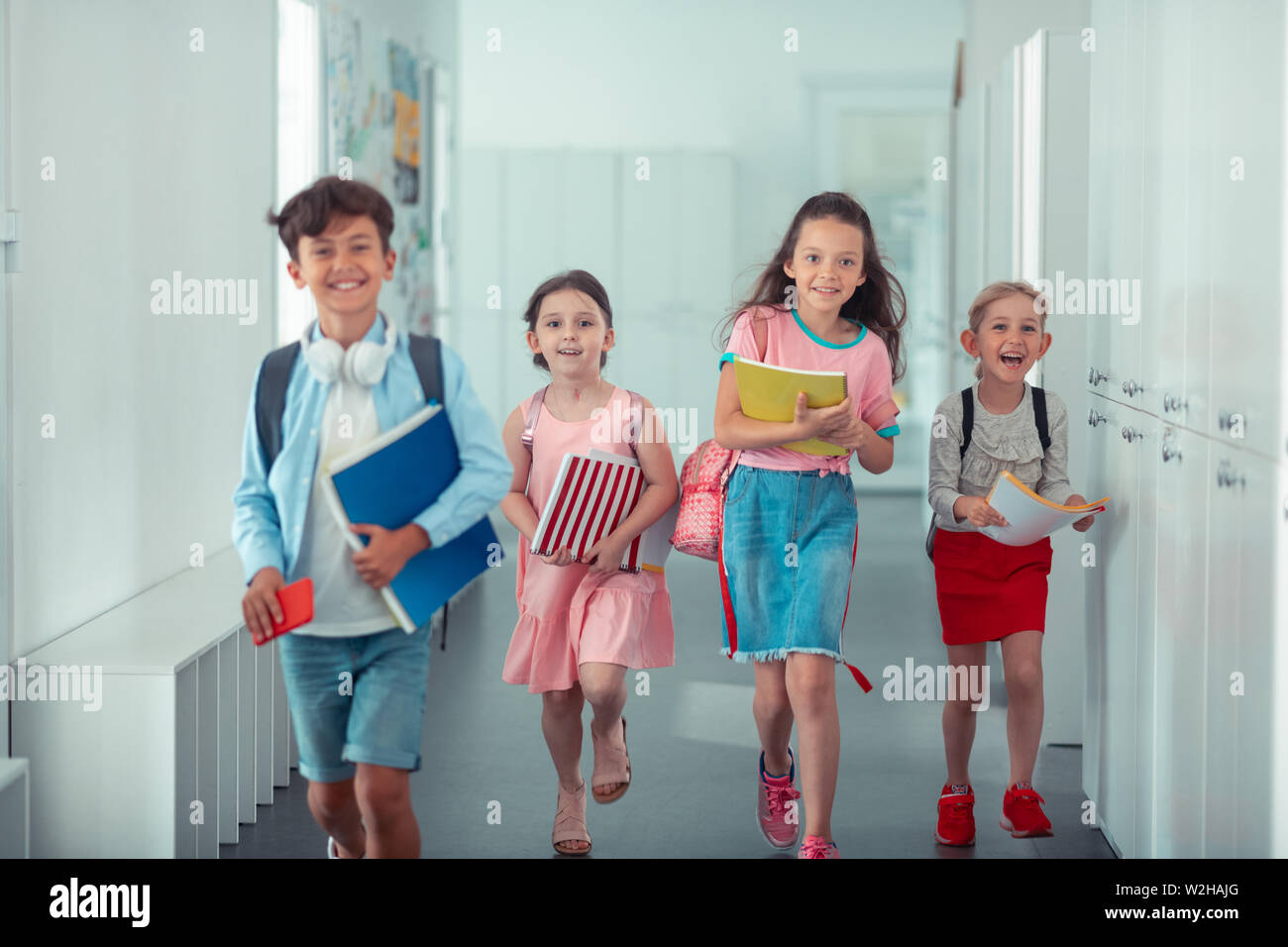 Cheerful happy children feeling happy after finishing school day Stock Photo