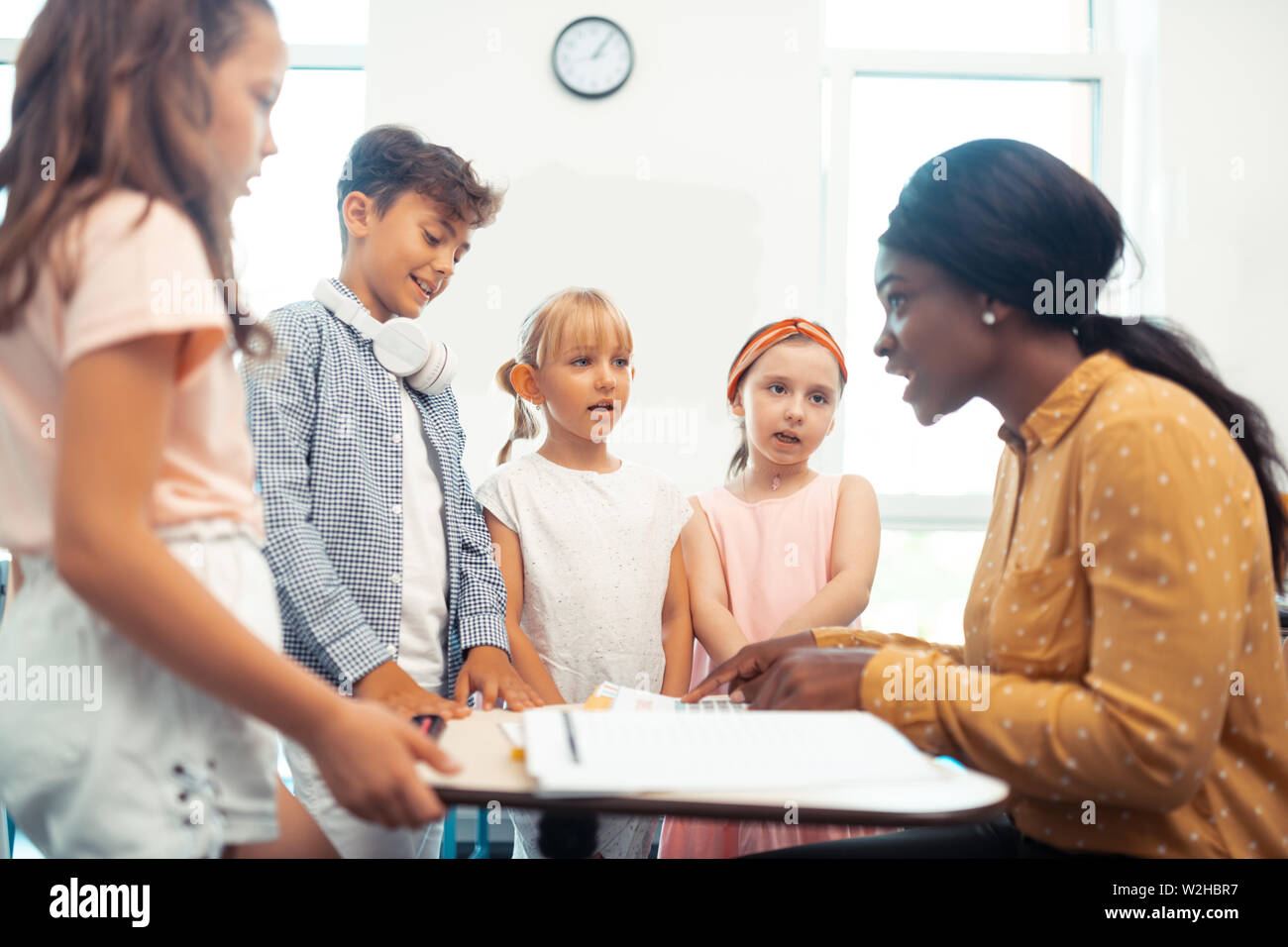 Dark skinned Teacher Telling Test Results For Her Smart Pupils Stock Photo Alamy