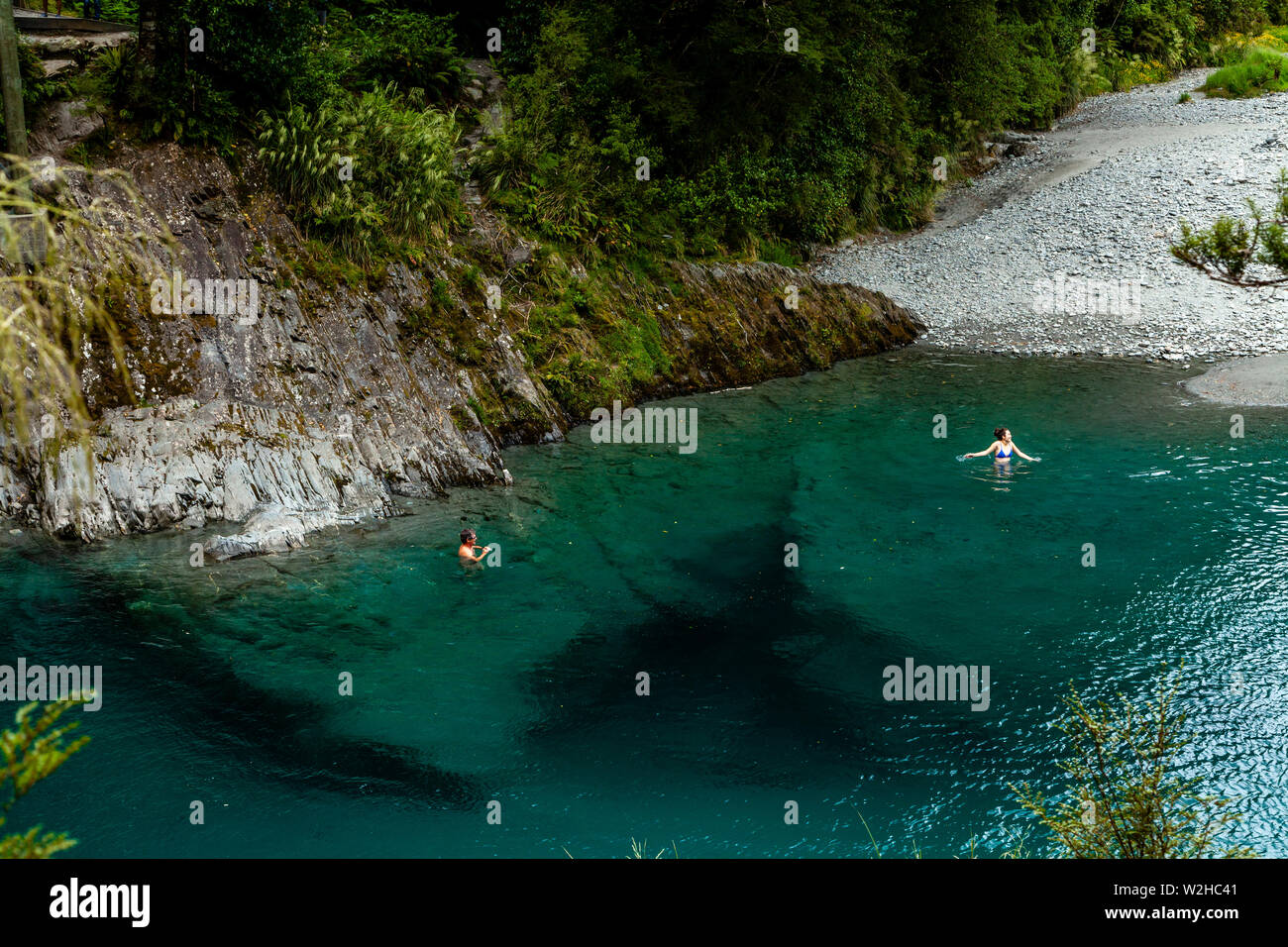 People Swimming In The Blue Pools (near Makarora), Mt Aspiring National Park, South Island, New Zealand Stock Photo