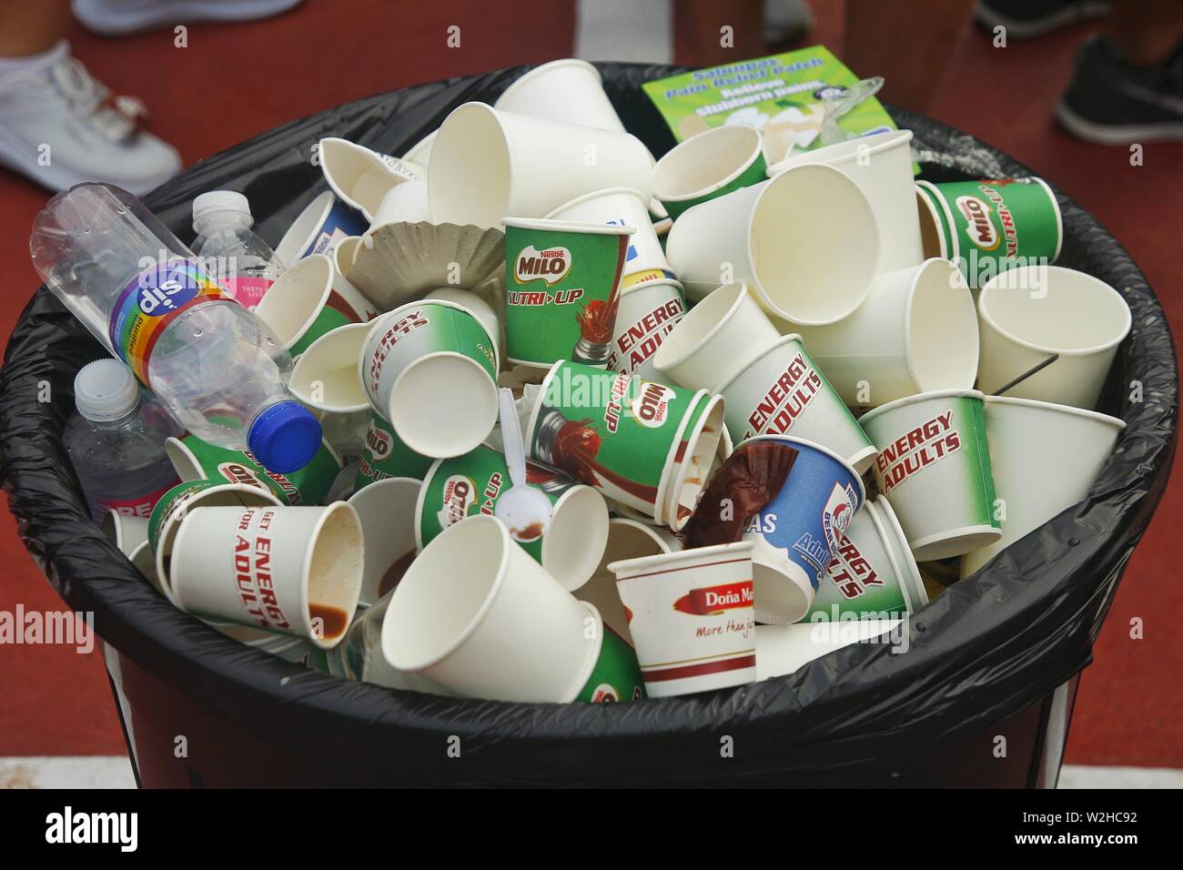 QUEZON CITY, PHILIPPINES – JULY 7, 2019: Plastic and paper cups in a ...