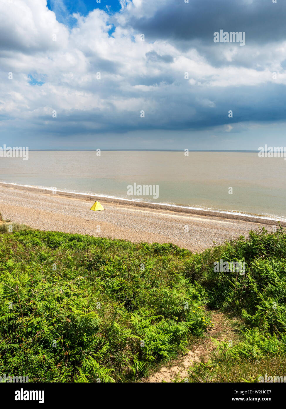 Fishing from the shingle beach between Thorpeness and Sizewell Suffolk England Stock Photo