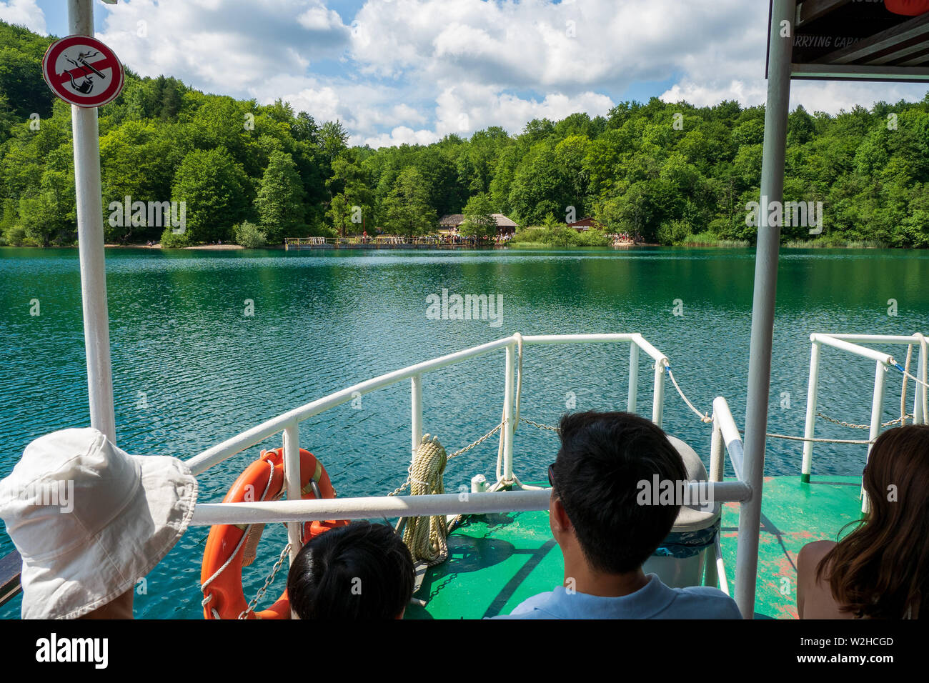 Ferry Navigating On The Turquoise Colored Crystal Clear And Pure