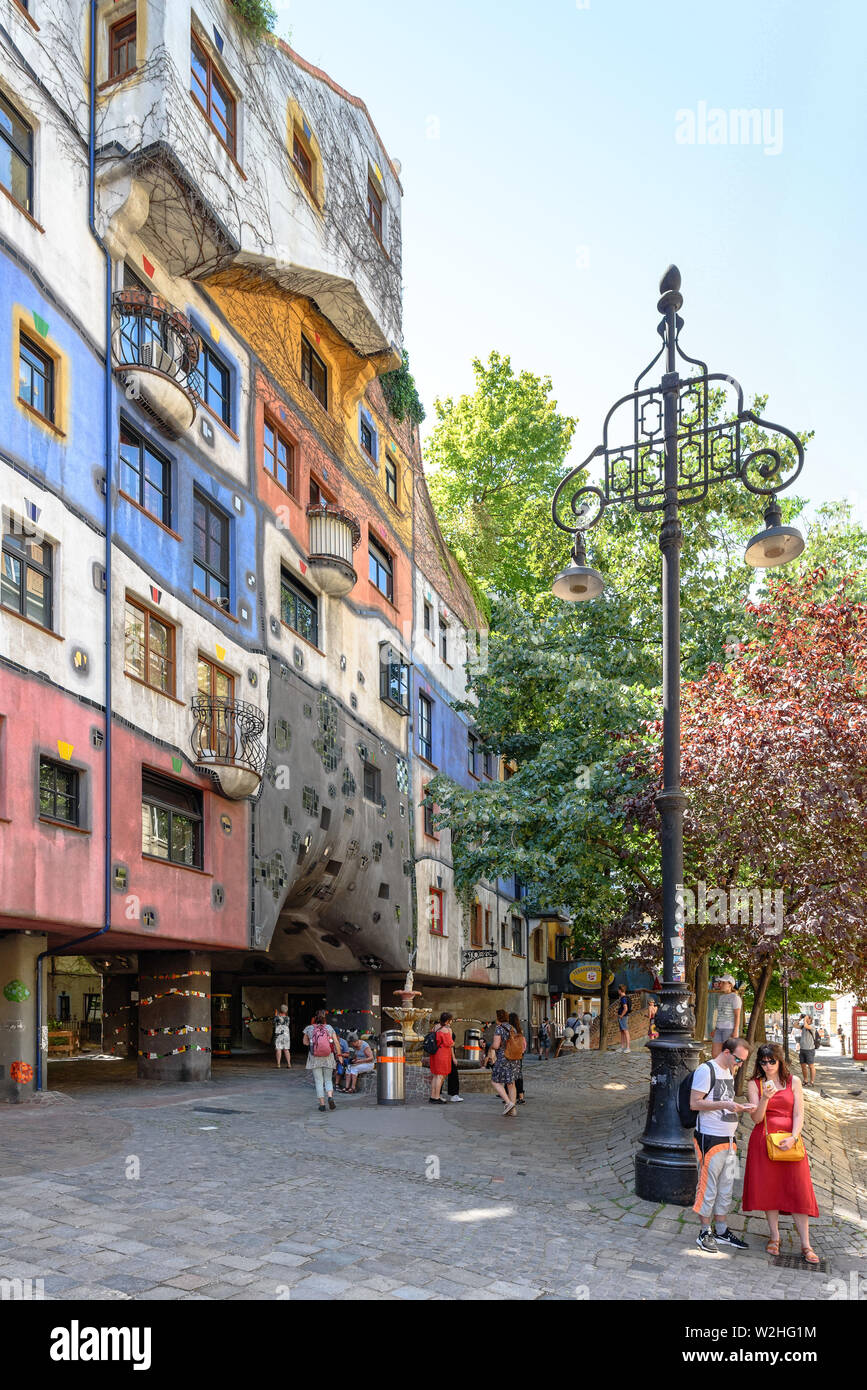 Tourists as the Hundertwasserhaus during the day in Vienna, Austria Stock Photo