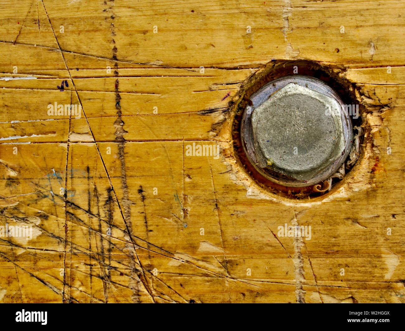 Wooden workbench aged surface with bolt, background with copy space. Stock Photo