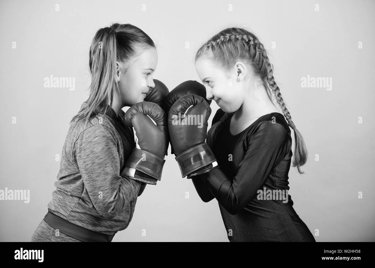 Girls in boxing sport. Boxer children in boxing gloves. Girls cute boxers  on blue background. Friendship as battle and competition. Pass boxing  challenge. Test for fortitude. Female friendship Stock Photo - Alamy