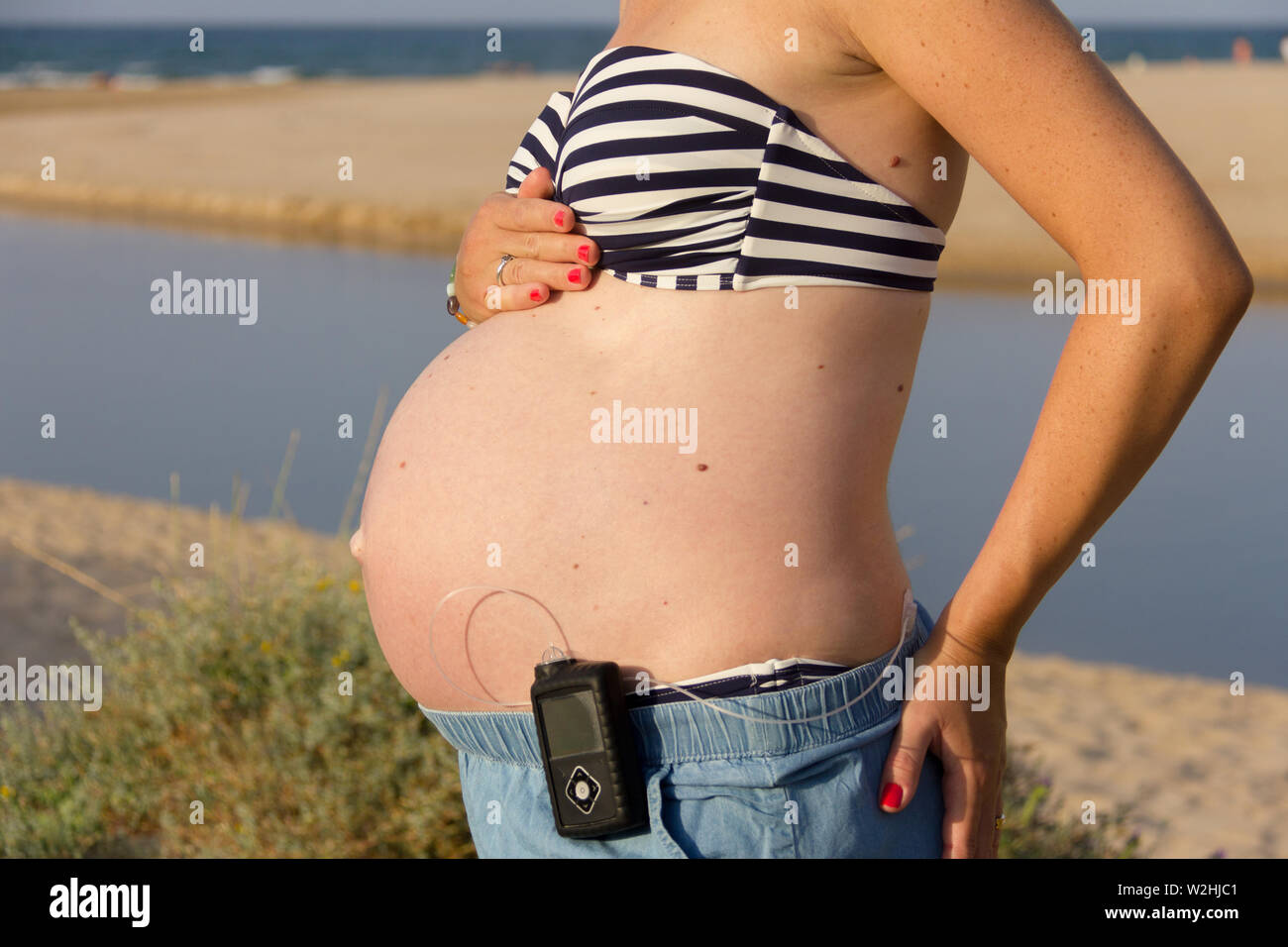 Hand On Stomach Bikini High Resolution Stock Photography And Images Alamy