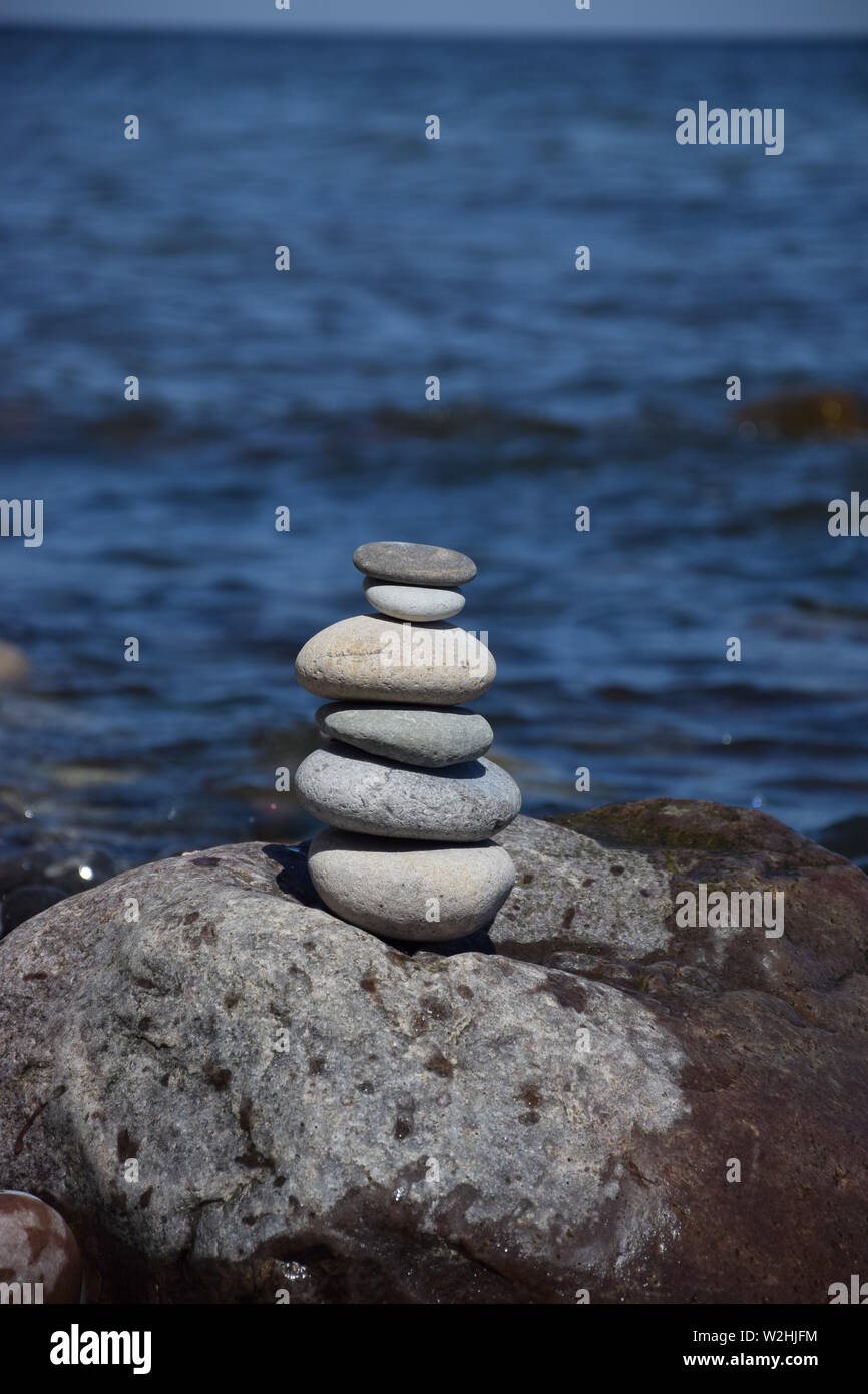 Stacked Stones at the Ocean Stock Photo