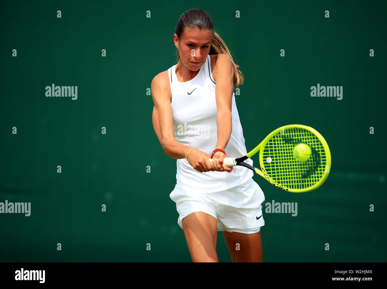 Selena Janicijevic in action during the girls singles on day eight of the  Wimbledon Championships at the All England Lawn Tennis and Croquet Club,  Wimbledon Stock Photo - Alamy