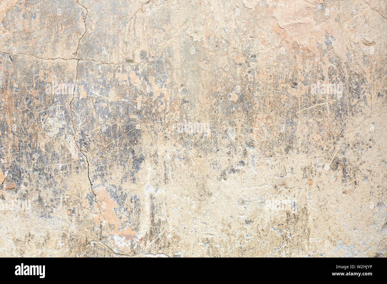 Old chipped and faded wall texture background in Italy Stock Photo
