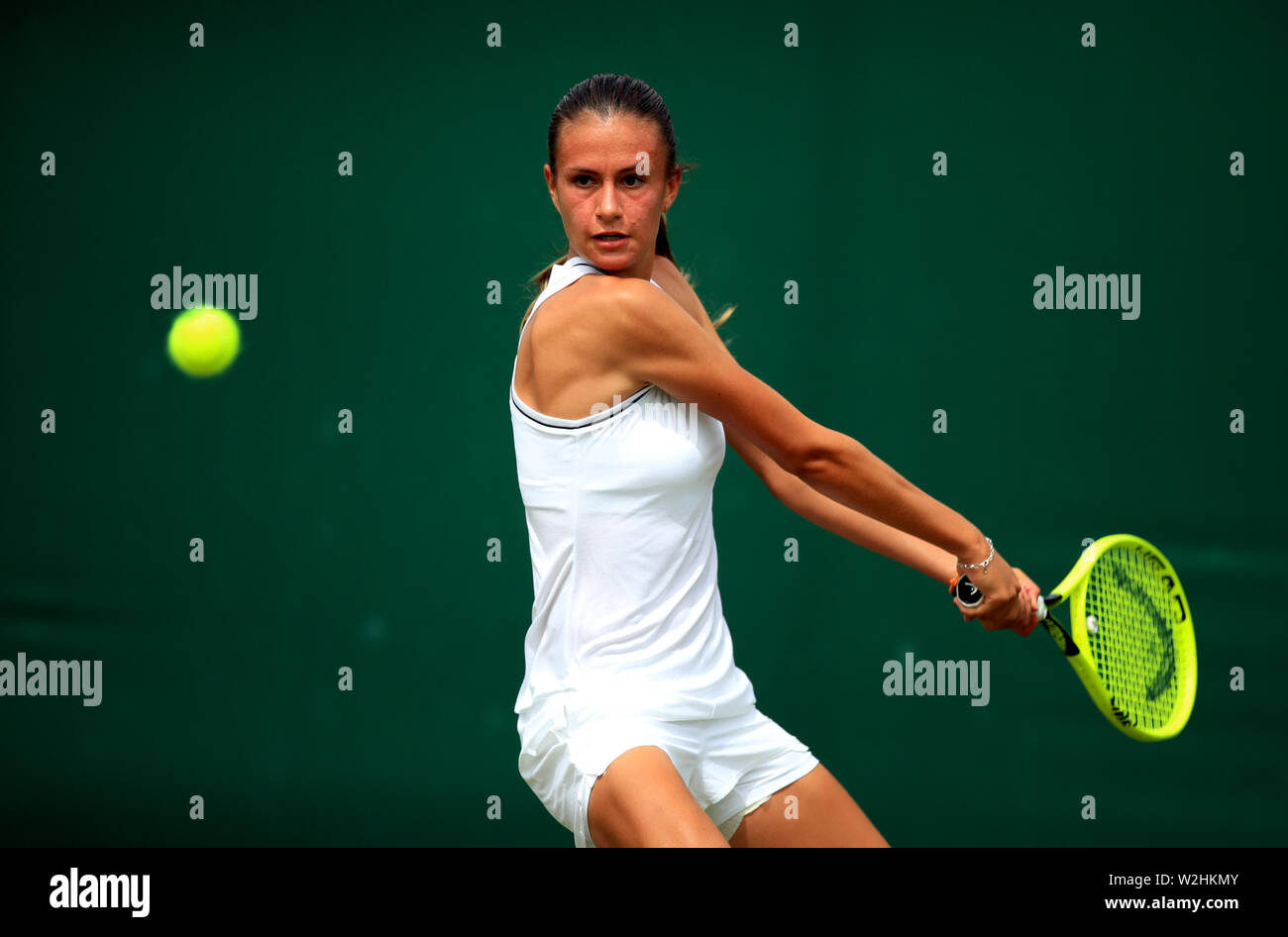 Selena Janicijevic in action during the girls singles on day eight of the  Wimbledon Championships at the All England Lawn Tennis and Croquet Club,  Wimbledon Stock Photo - Alamy