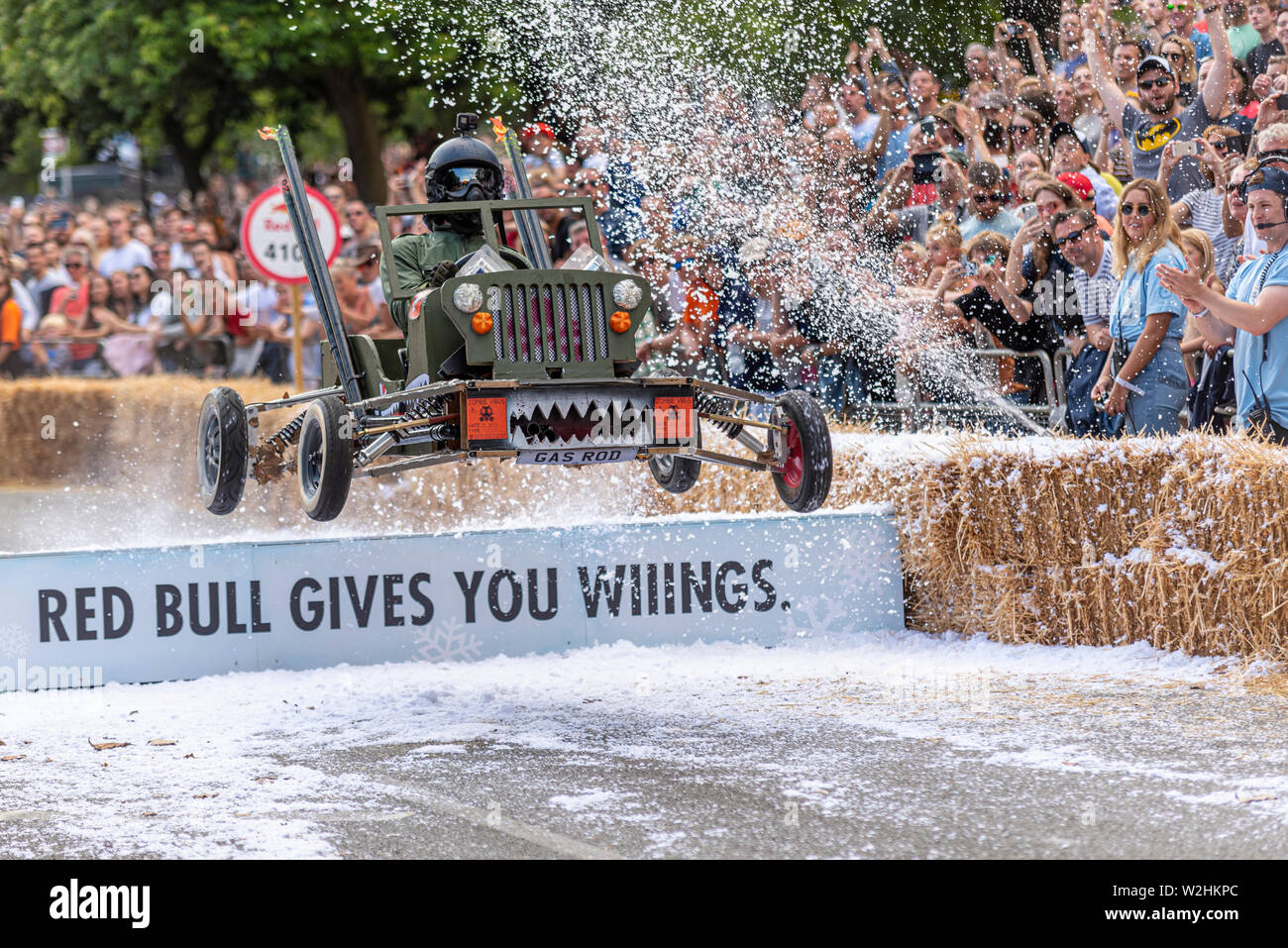 Team Gas Gas Gas Willys Jeep competing in the Red Bull Soapbox Race 2019 at Park, London, UK. Jumping over ramp people. winner Stock Photo - Alamy