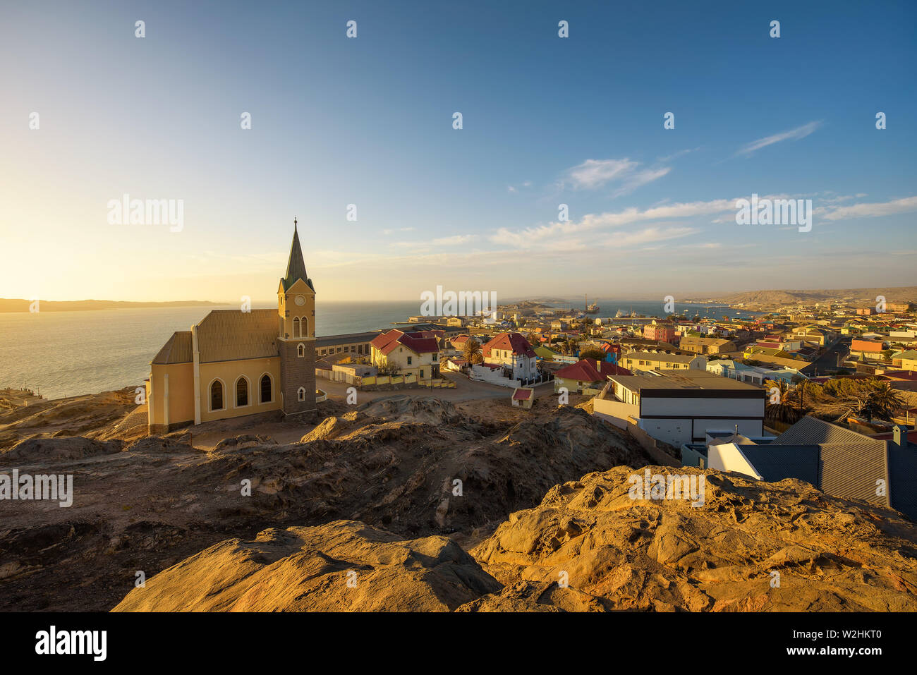 Luderitz in Namibia with lutheran church called Felsenkirche at sunset Stock Photo