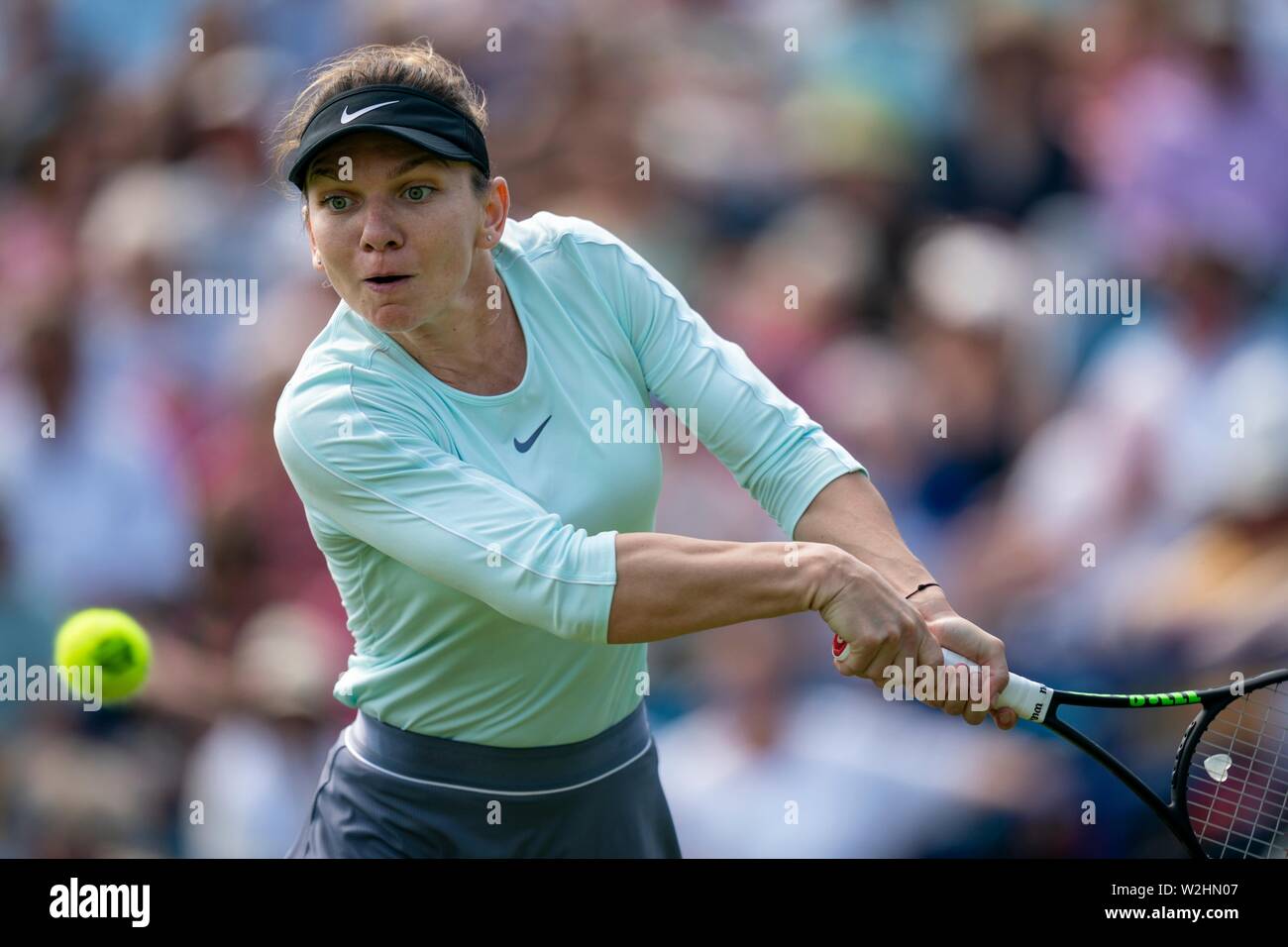 Simona Halep of Romania playing two handed backhand against Polona Hercog of Slovakia at Nature Valley International 2019, Devonshire Park, Eastbourne Stock Photo