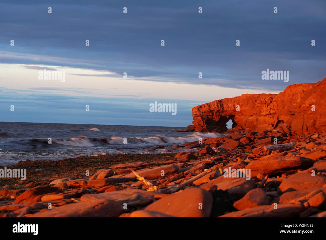 Red cliffs on Prince Edwards Island at sunset Stock Photo