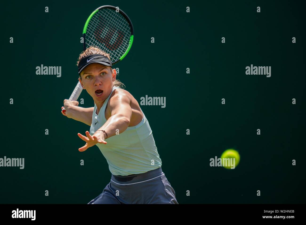 Simona Halep of Romania in action against Angelique Kerber of Germany at Nature Valley International 2019, Devonshire Park, Eastbourne - England. Thur Stock Photo