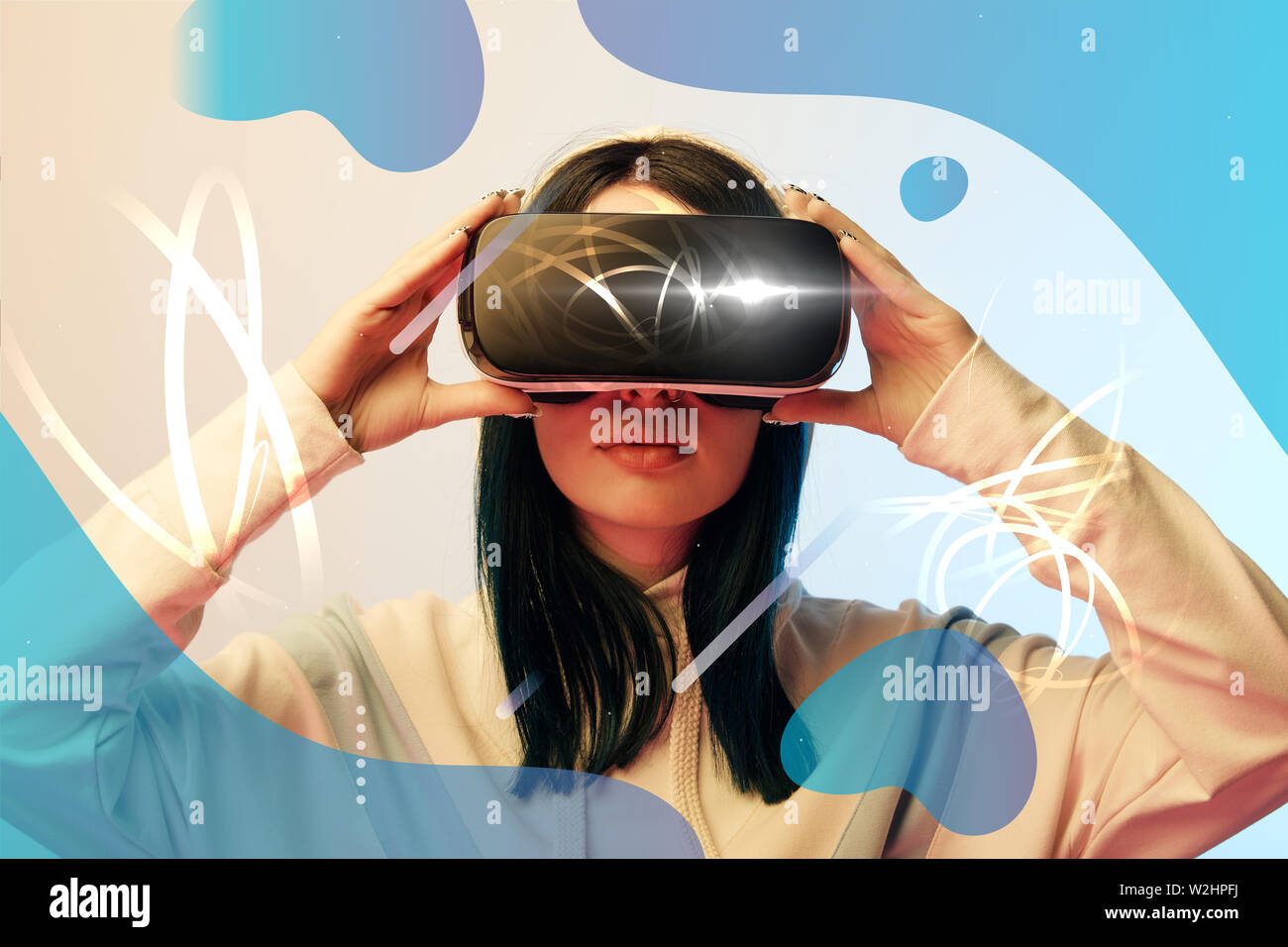 young woman in virtual reality headset with glowing cyber and abstract ...