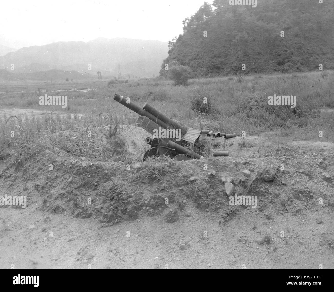 Decoy Artillery. Republic of Korea (ROK) troops in the 25th US Infantry Division Sector in Korea set up this wooden 105 MM Howitzer as part of a decoyed line of fire to throw enemy fire-power off guard ca. 8/1951 Stock Photo