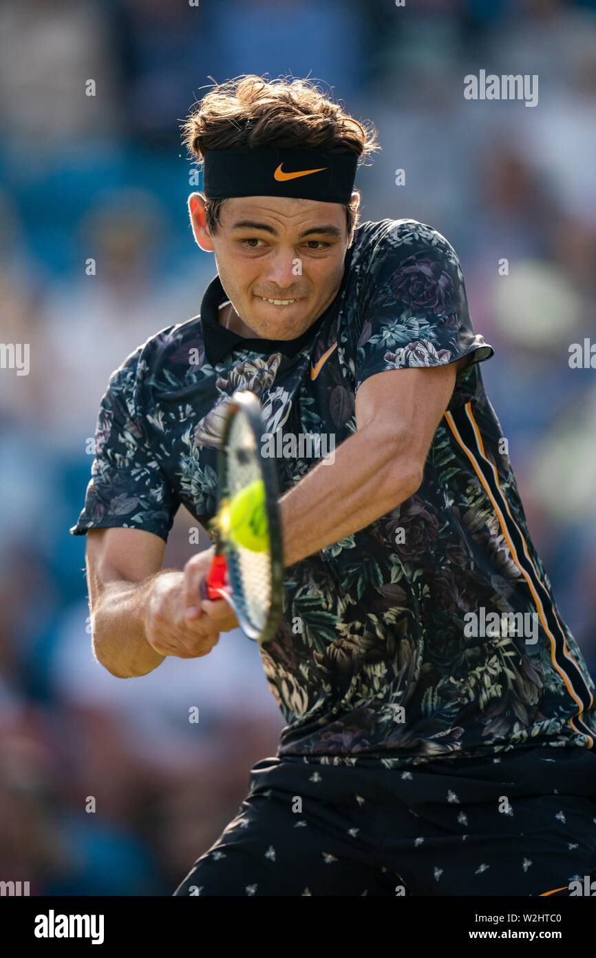 Taylor Fritz of USA playing two handed backhand against Kyle Edmund of GBR at Nature Valley International 2019, Devonshire Park, Eastbourne - England. Stock Photo
