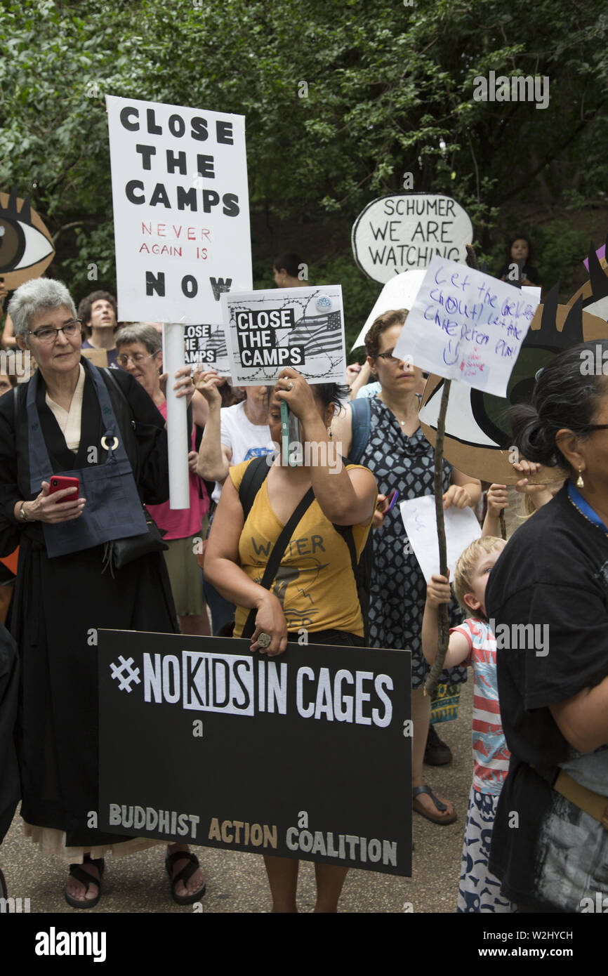 New Yorkers gather across the street from Senator Chuck Schumer's home in Park Slope, Brooklyn, NY on a national day of protest concerning the way asylum seekers, especially children are being treated in interment camps along the US Mexican Border. The government is not moving fast enough to alleviate the inhumane conditions there. They chanted 'Close the camps.' Stock Photo