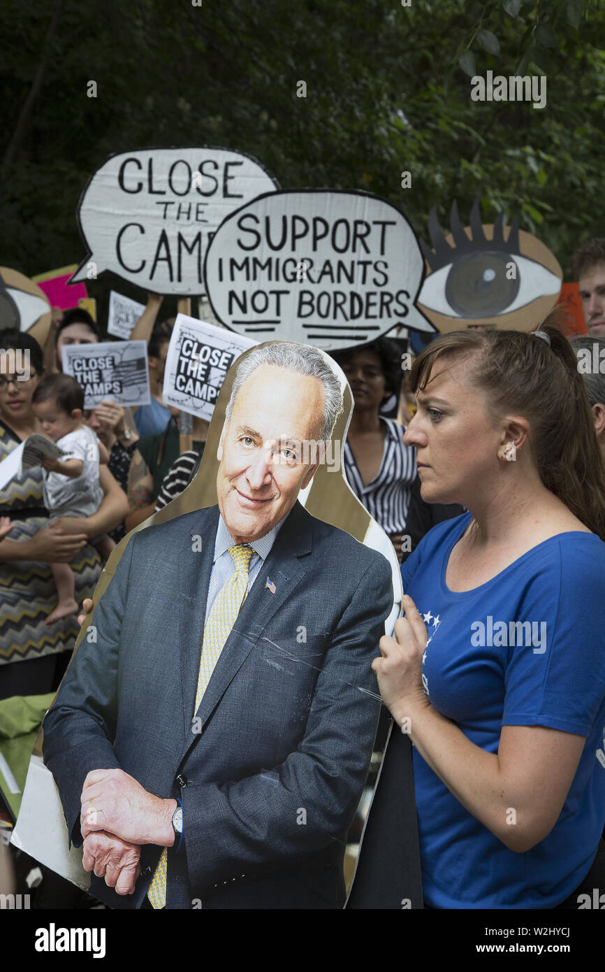 New Yorkers gather across the street from Senator Chuck Schumer's home in Park Slope, Brooklyn, NY on a national day of protest concerning the way asylum seekers, especially children are being treated in interment camps along the US Mexican Border. The government is not moving fast enough to alleviate the inhumane conditions there. They chanted 'Close the camps.' Stock Photo