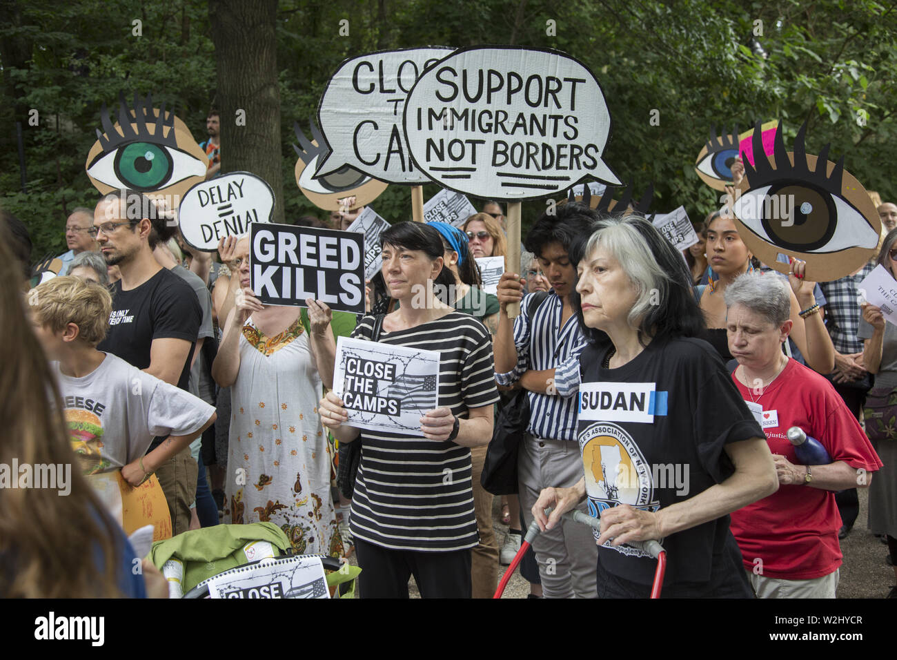 New Yorkers gather across the street from Senator Chuck Schumer's home in Park Slope, Brooklyn, NY on a national day of protest concerning the way asylum seekers, especially children are being treated in interment camps along the US Mexican Border. The government is not moving fast enough to alleviate the inhumane conditions there. They chanted 'Close the camps.' Stock Photo