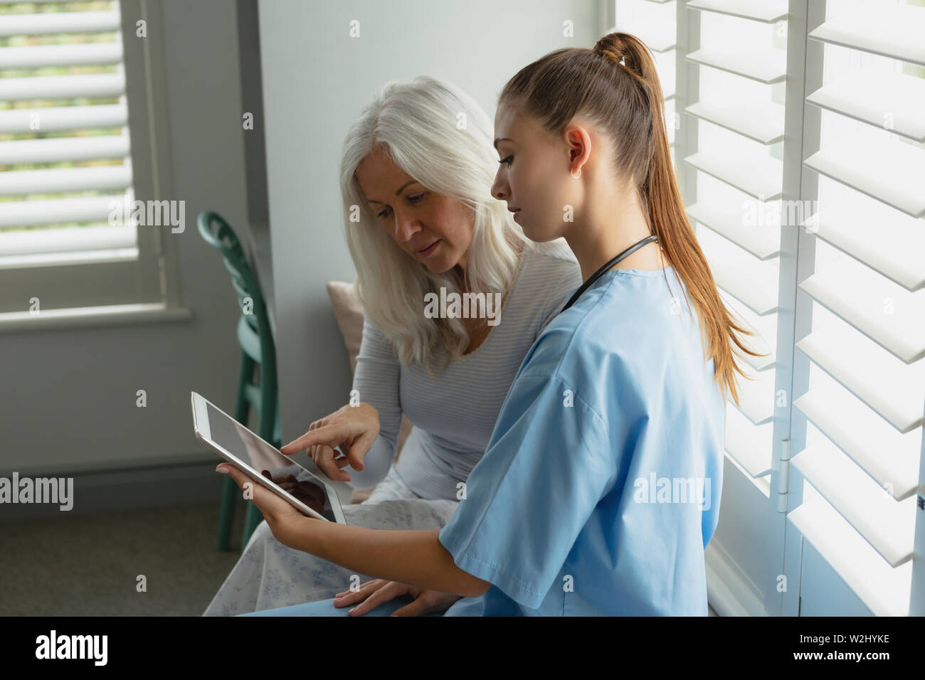 Woman with female doctor hi-res stock photography and images - Alamy