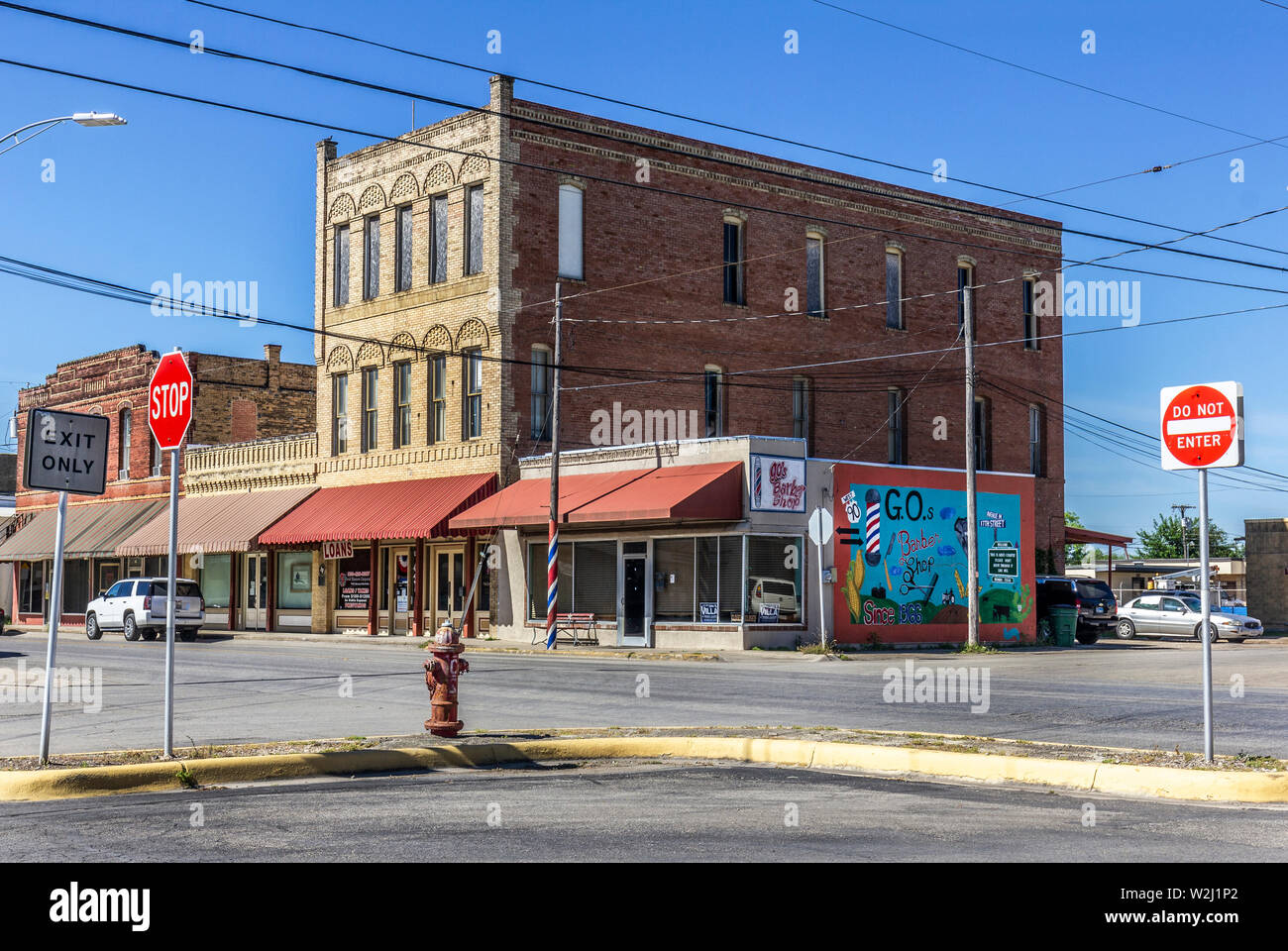 Downtown Hondo, with empty street, fire hydrant, shops and mural, Texas, USA. Stock Photo
