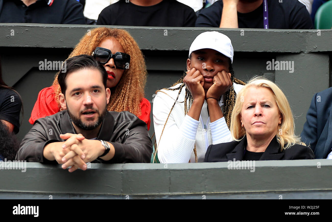 Venus Williams, Oracene Price and Alexis Ohanian watch Serena Williams in action on day eight of the Wimbledon Championships at the All England Lawn tennis and Croquet Club, Wimbledon. Stock Photo