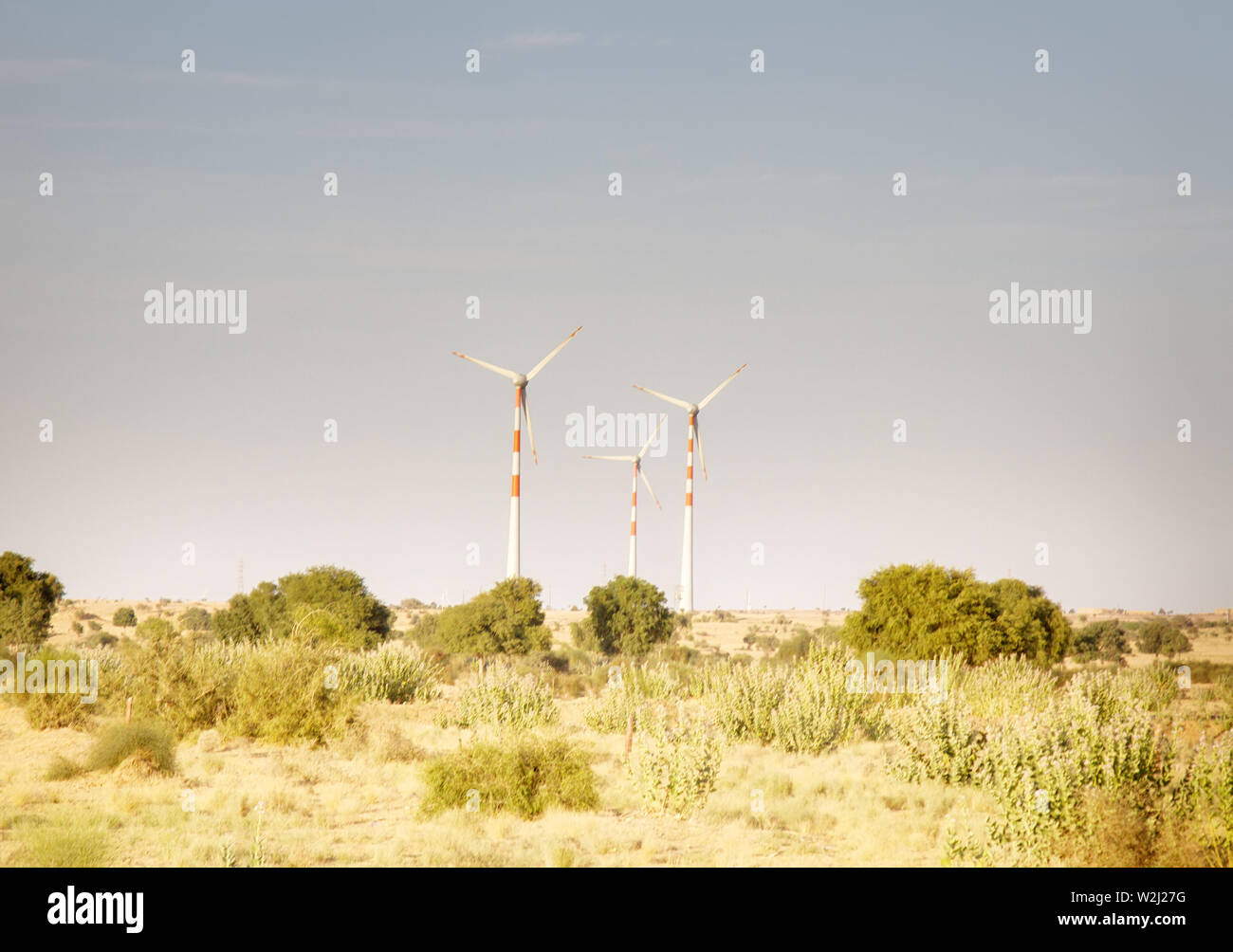 Indian energy, modern power industry, alternative power engineering. Wind turbines in the desert in Rajasthan Stock Photo