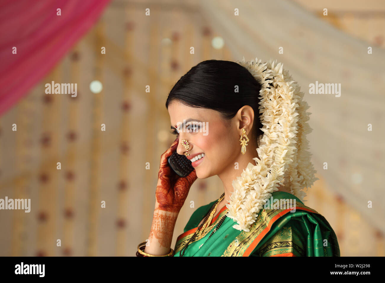 Indian young Woman talking on a mobile phone Stock Photo - Alamy
