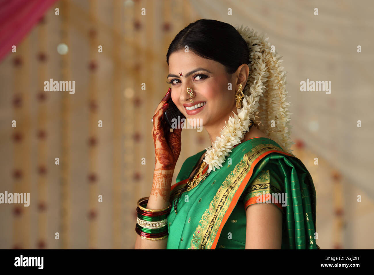 Indian young woman talking on a mobile phone Stock Photo - Alamy