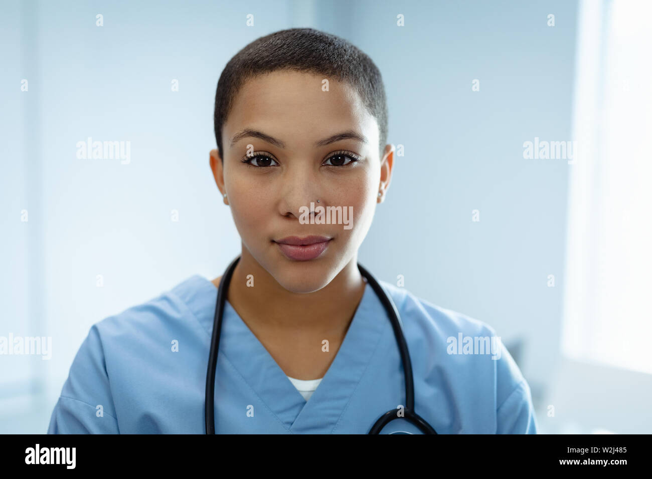 Female doctor smiling in the hospital Stock Photo