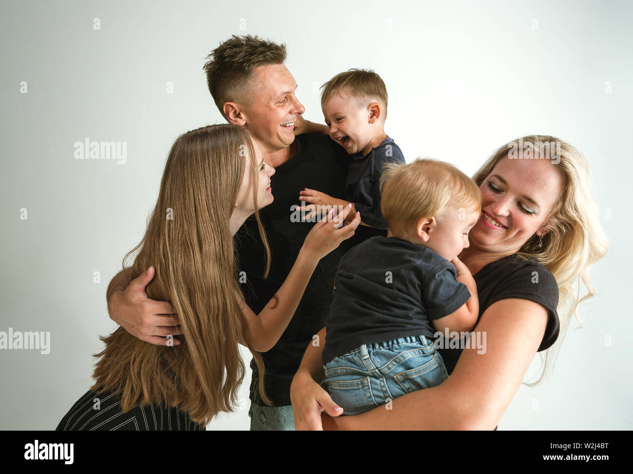 Young family spending time together and smiling. Parents with young ...