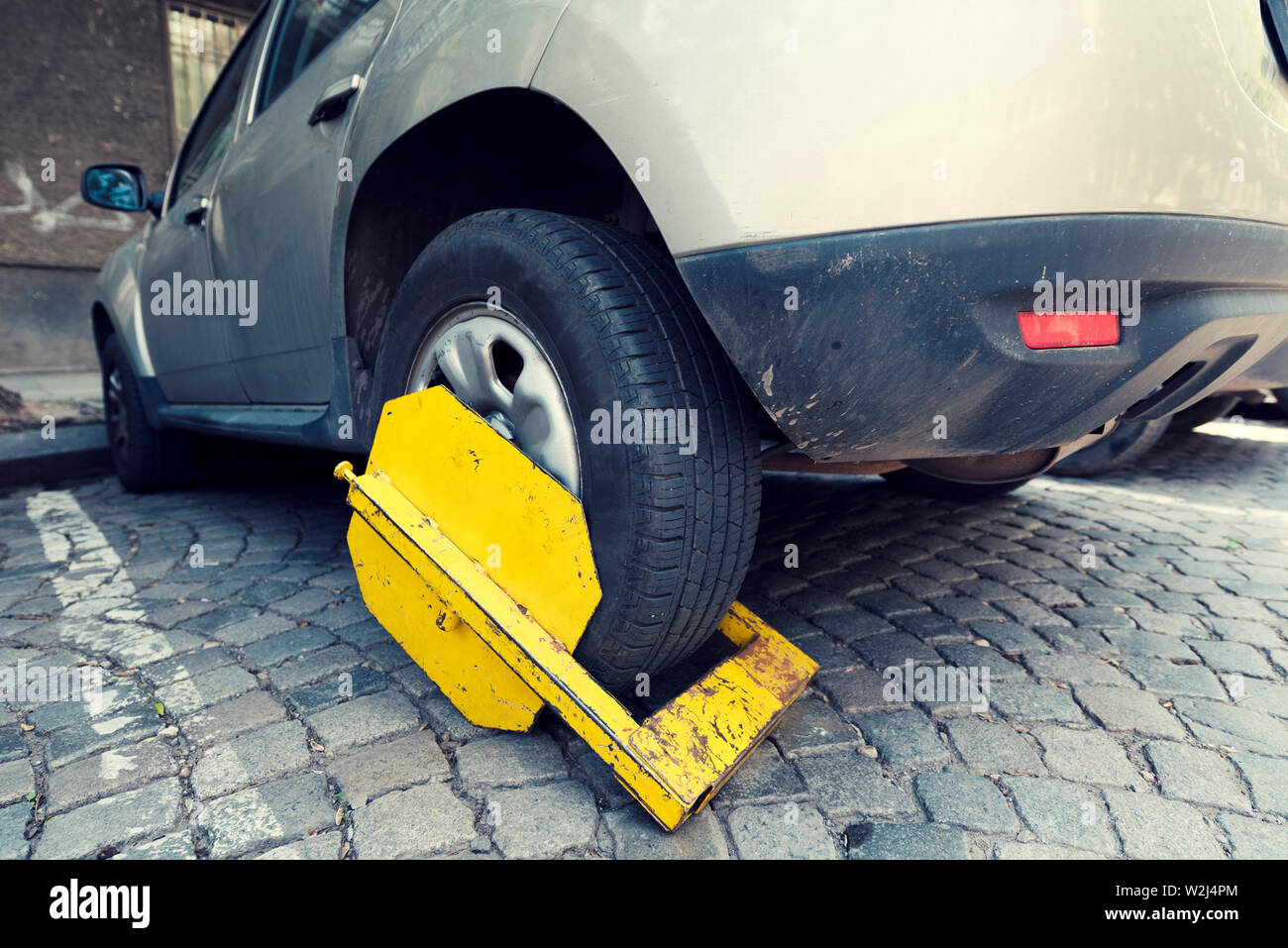 Car wheel clamped illegal parking hires stock photography and images