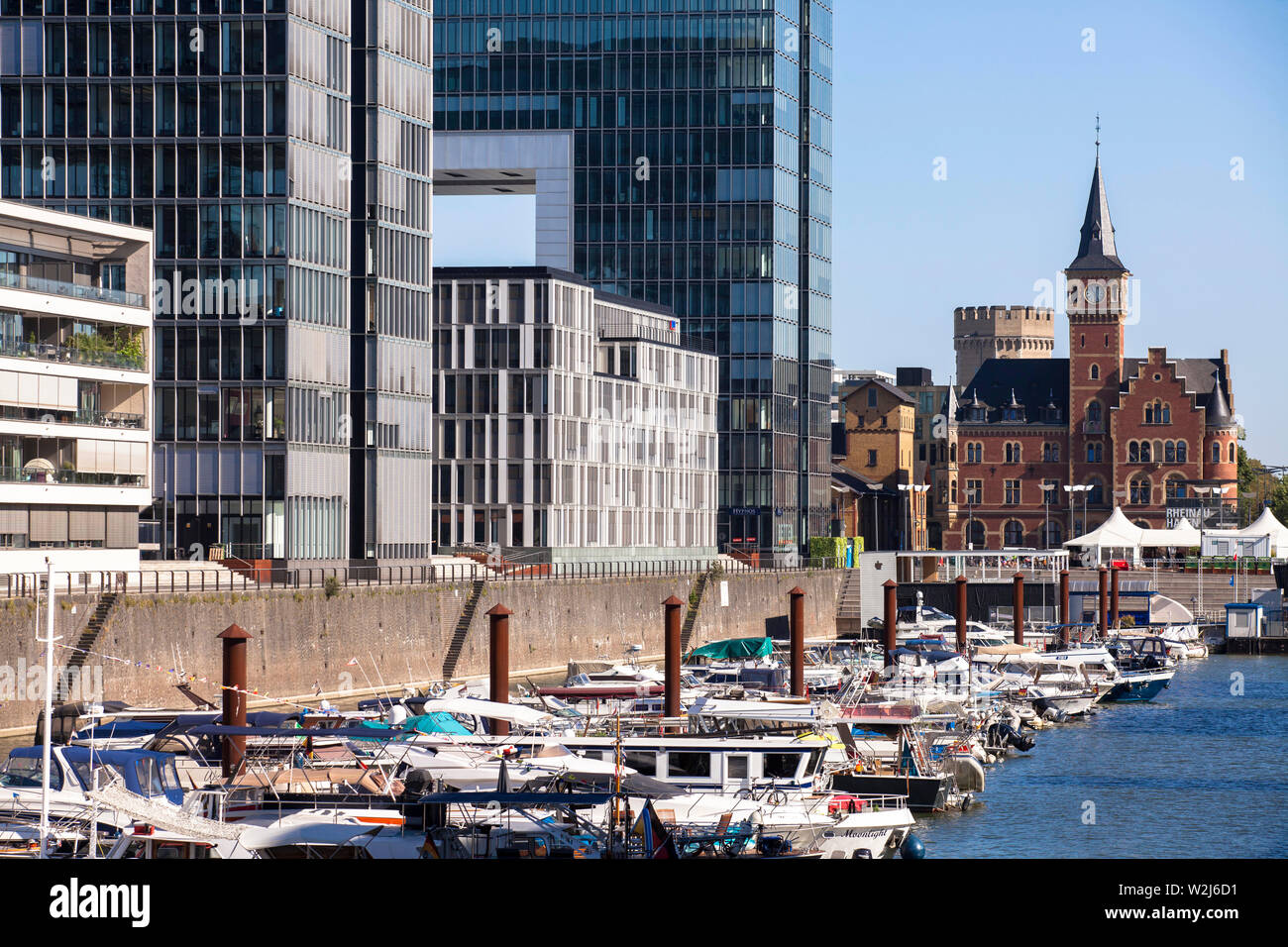 boats at the Rheinau harbour, in the background the old harbours masters office, on the left the crane houses, Cologne, Germany.  Boote im Rheinauhafe Stock Photo