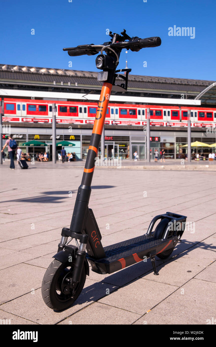 Circ electric scooters for rental at the main station, Cologne, Germany.  Circ Elektroscooter zum mieten am Hauptbahnhof, Koeln, Deutschland. Stock Photo