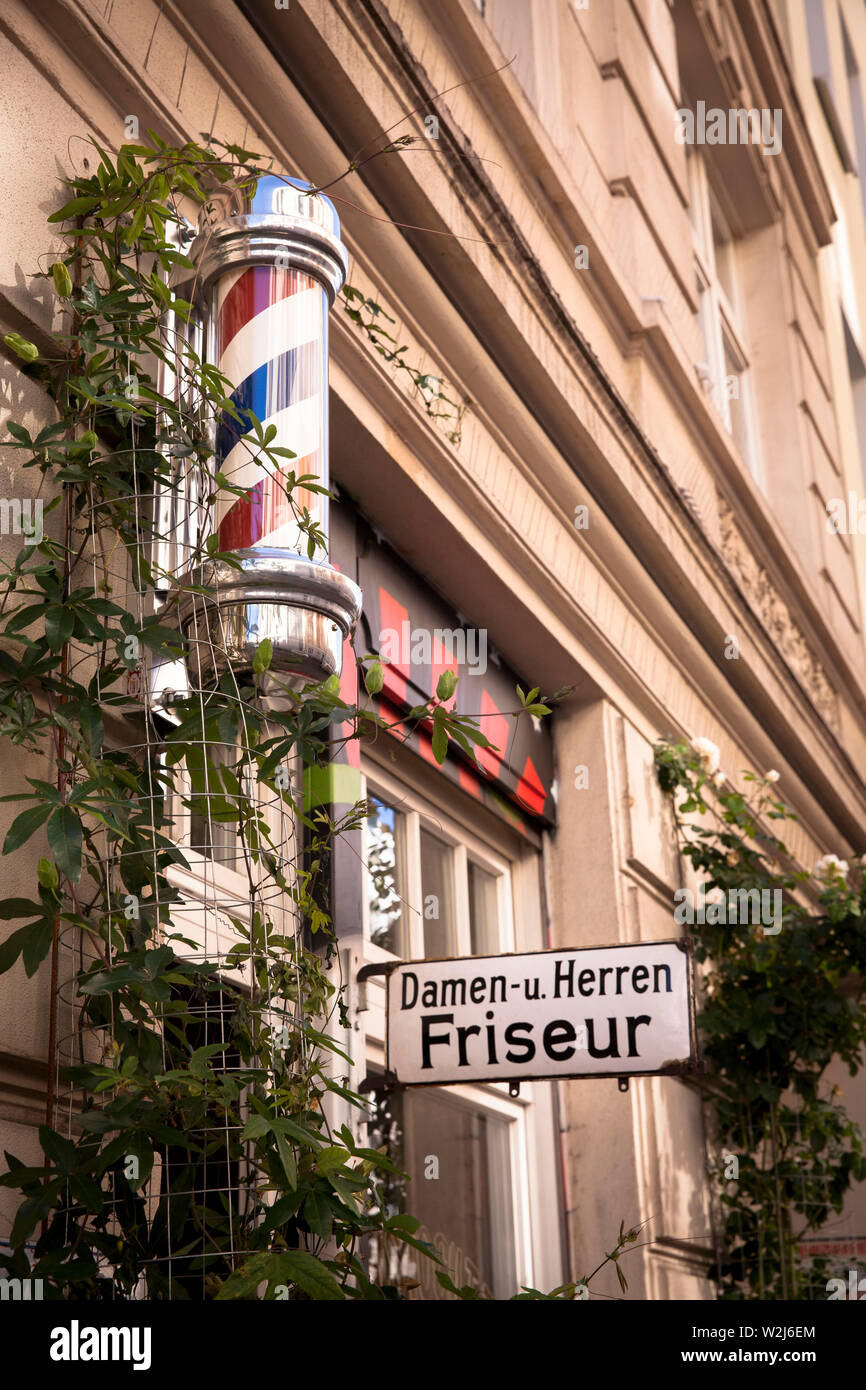 hairdresser on Dom streat, barberpole, Cologne, Germany. Friseur in der
