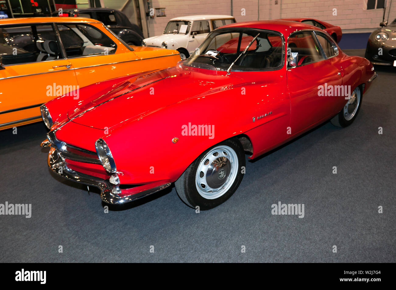 Three-quarter front view of a Red, 1966,  Alfa Romeo Giulia SS,on display at the 2019 London Classic Car Show Stock Photo