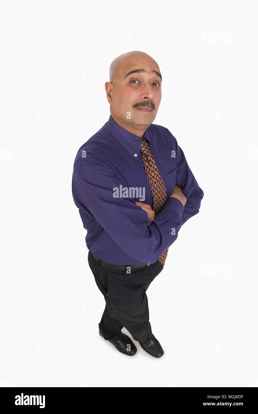 High angle view of a businessman standing with his arms crossed Stock Photo