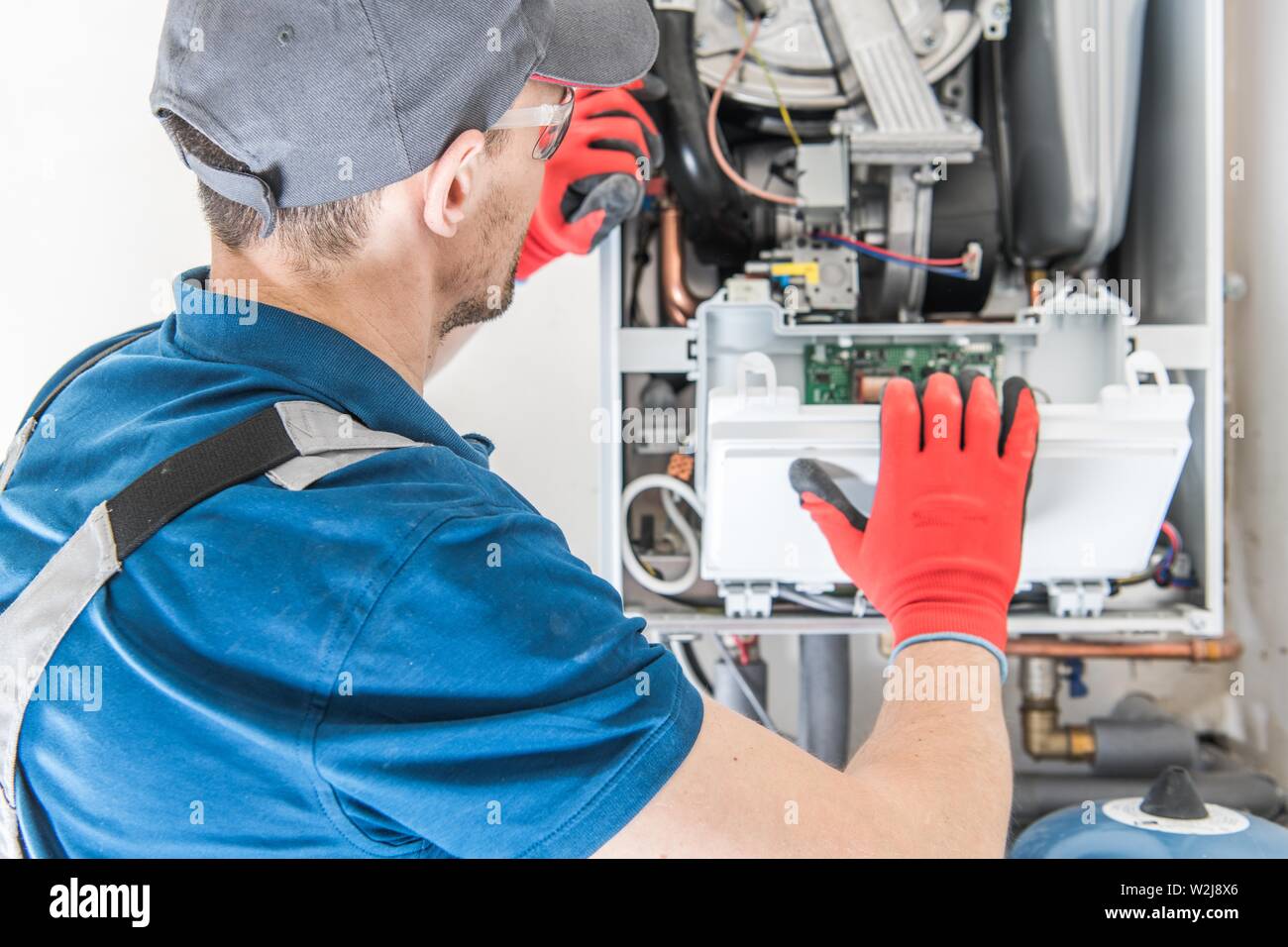Heating Central Gas Furnace Issue. Technician Trying To Fix the Problem