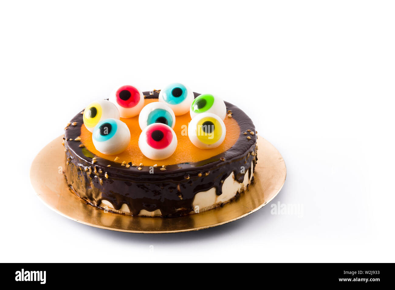 Halloween cake with candy eyes decoration isolated on white ...