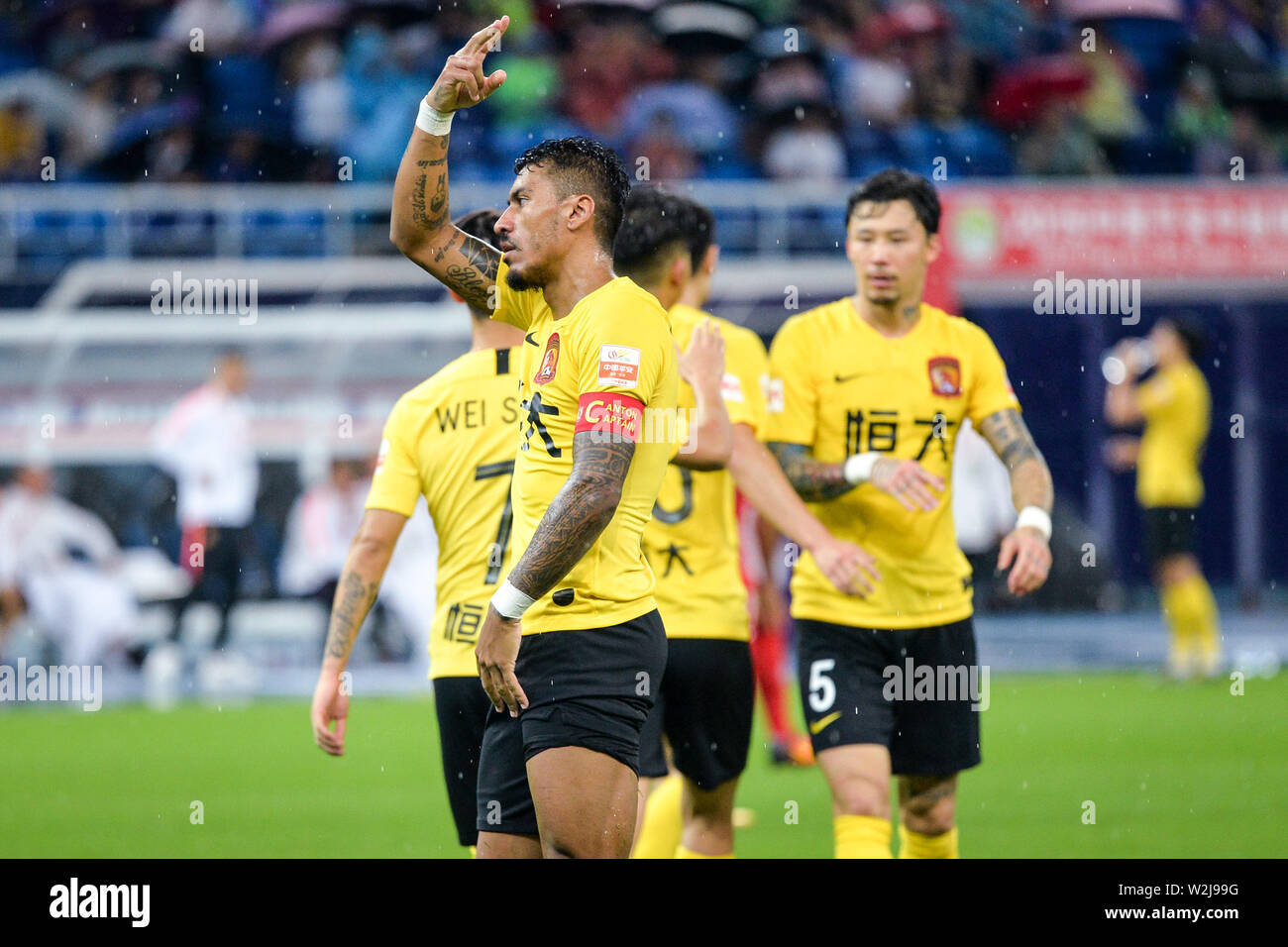 Brazilian football player Paulinho of Guangzhou Evergrande Taobao celebrates after scoring against Tianjin Tianhai in their 15th round match during the 2019 Chinese Football Association Super League (CSL) in Tianjin, China, 5 July 2019. Guangzhou Evergrande Taobao defeated Tianjin Tianhai 3-0. Stock Photo