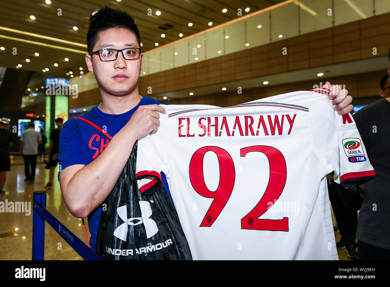 A Chinese fan shows a team jersey of Italian football player Stephan El  Shaarawy at the Shanghai Pudong International Airport during the 2019  Chinese Football Association Super League (CSL) in Shanghai, China,