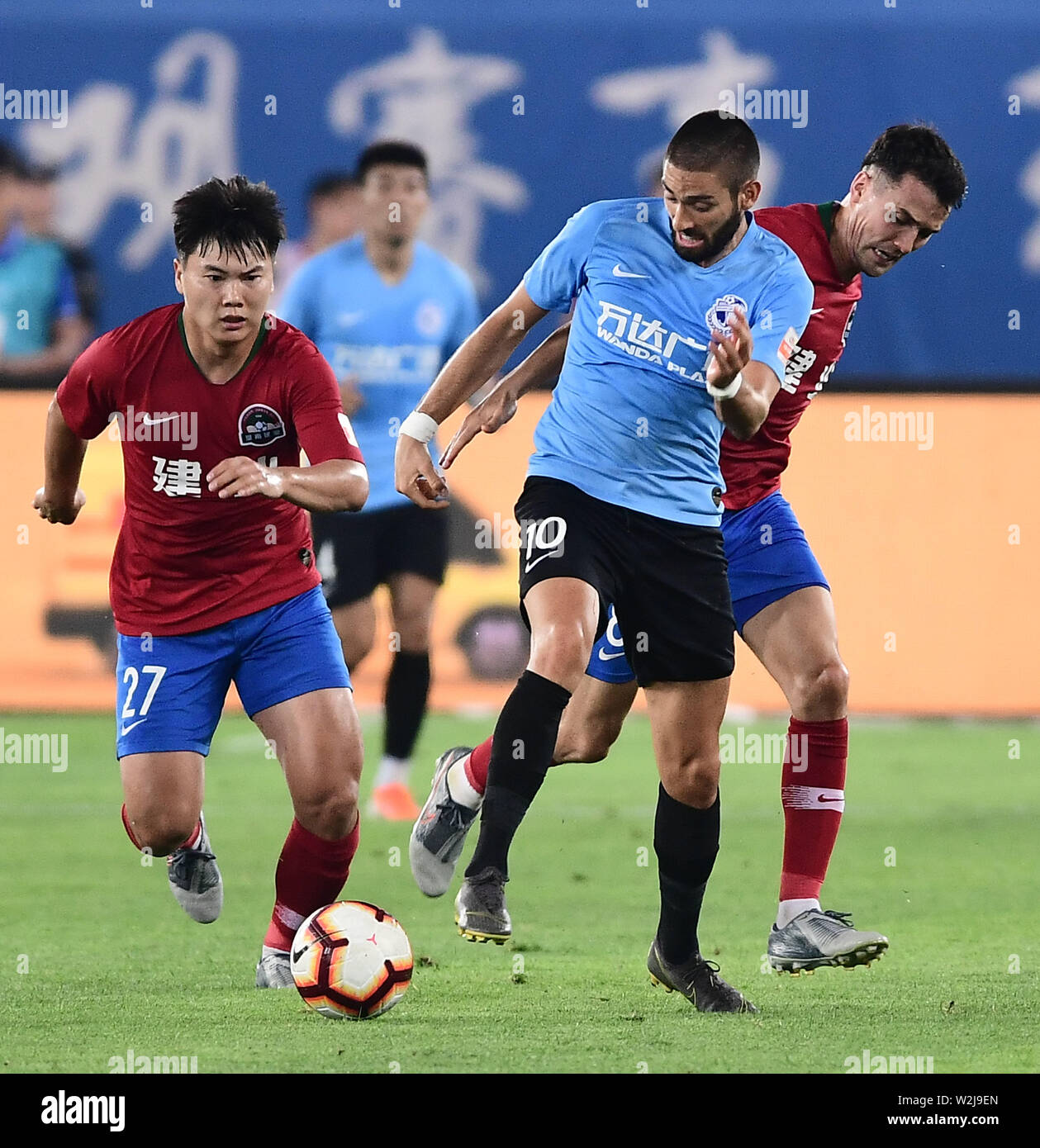 Belgian football player Yannick Ferreira Carrasco, center, of Dalian