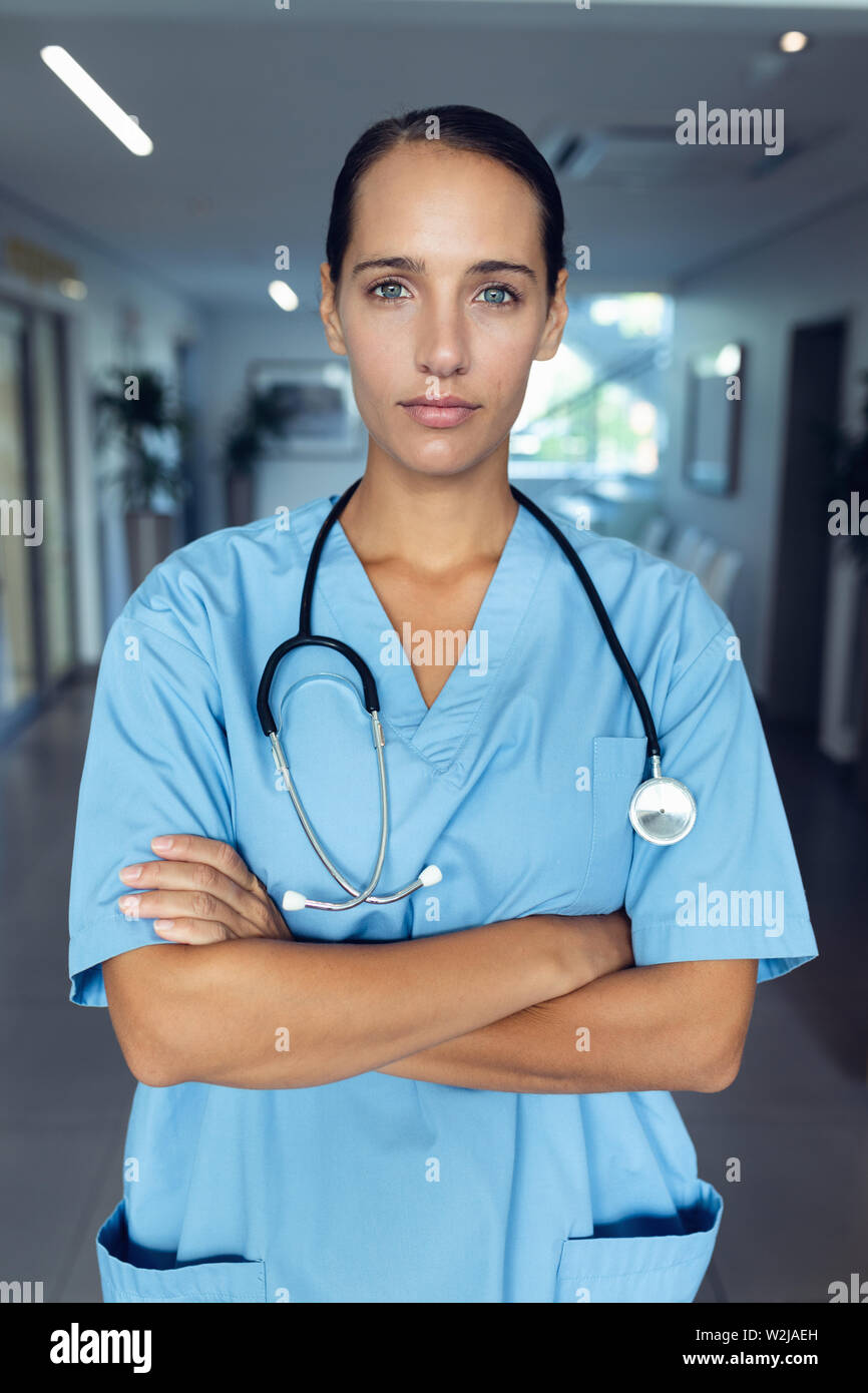 Female doctor standing with arms crossed in the hospital Stock Photo ...