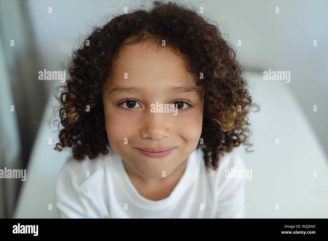 Boy sitting on bed in the ward at hospital Stock Photo