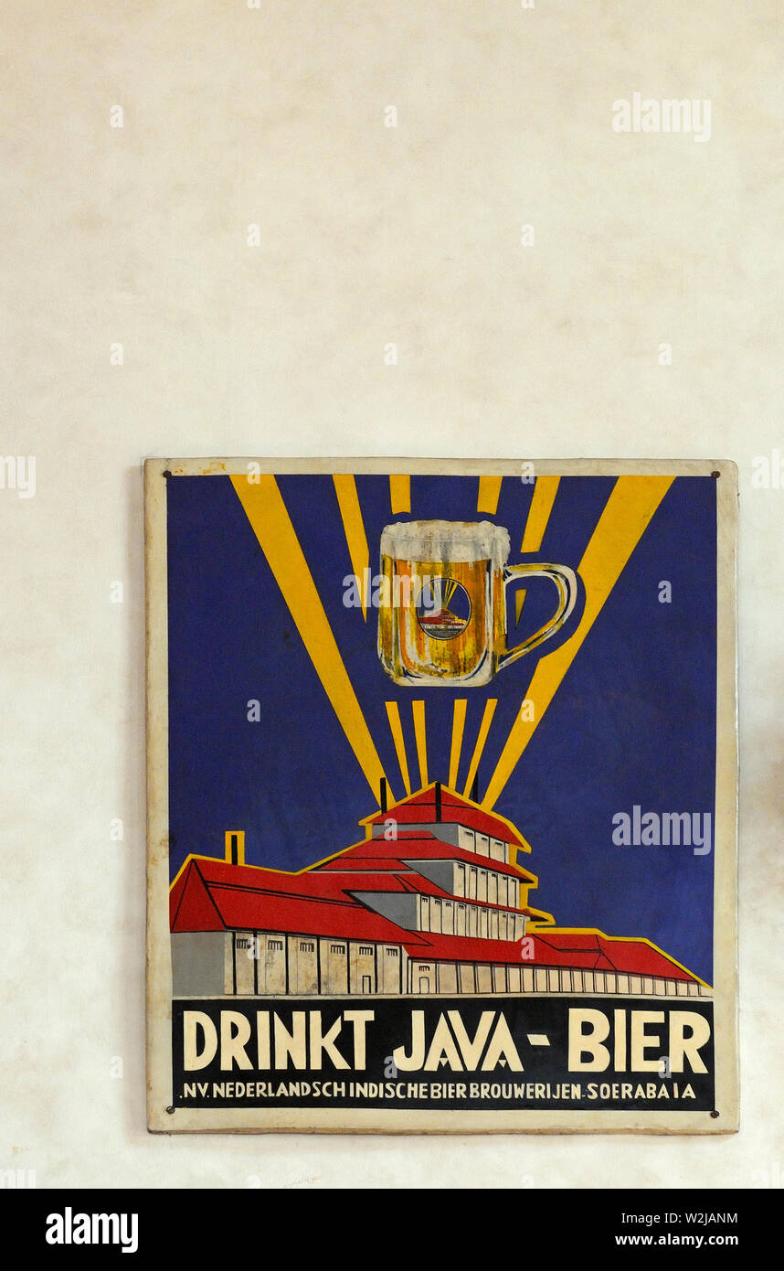 surabaya, jawa timur/ indonesia - november 10, 2009: a vintage  enamel advertisement board of  nv nederlandsch indische bierbrouwerijen soerabaia ( es Stock Photo