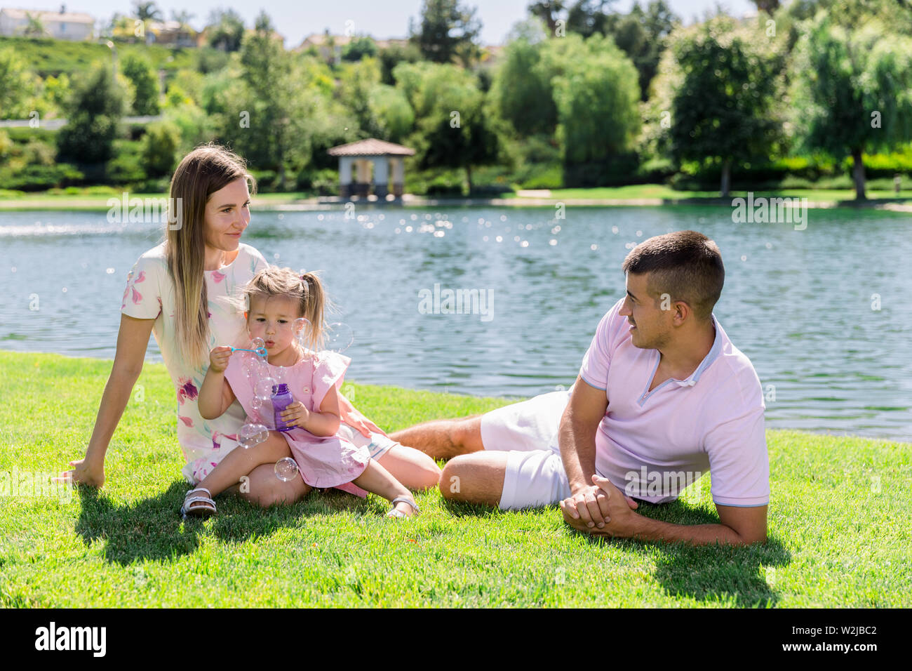 Happy family at the park having a good time together Stock Photo