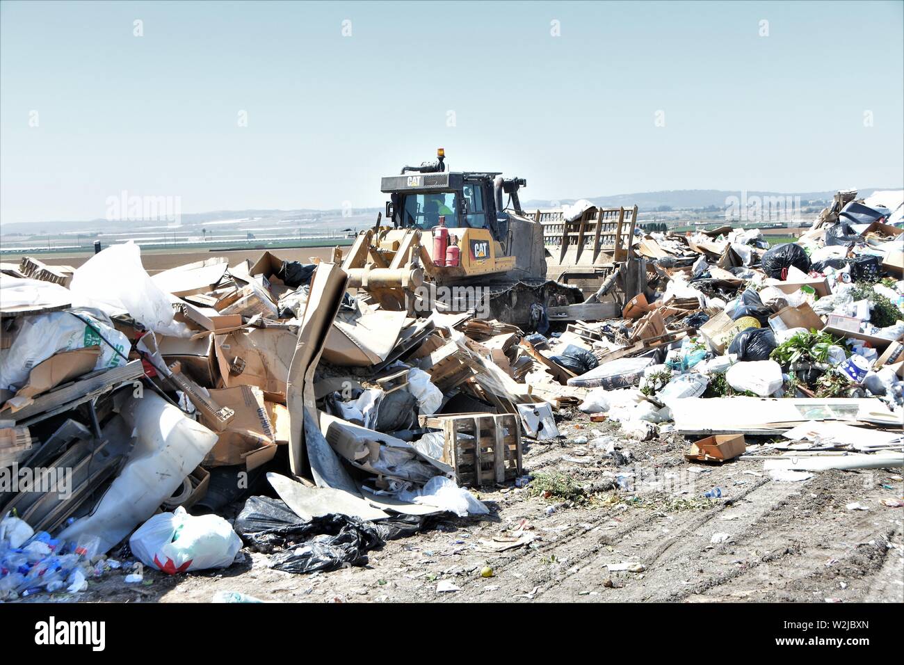 Trash dump in California USA where household litter is buried and