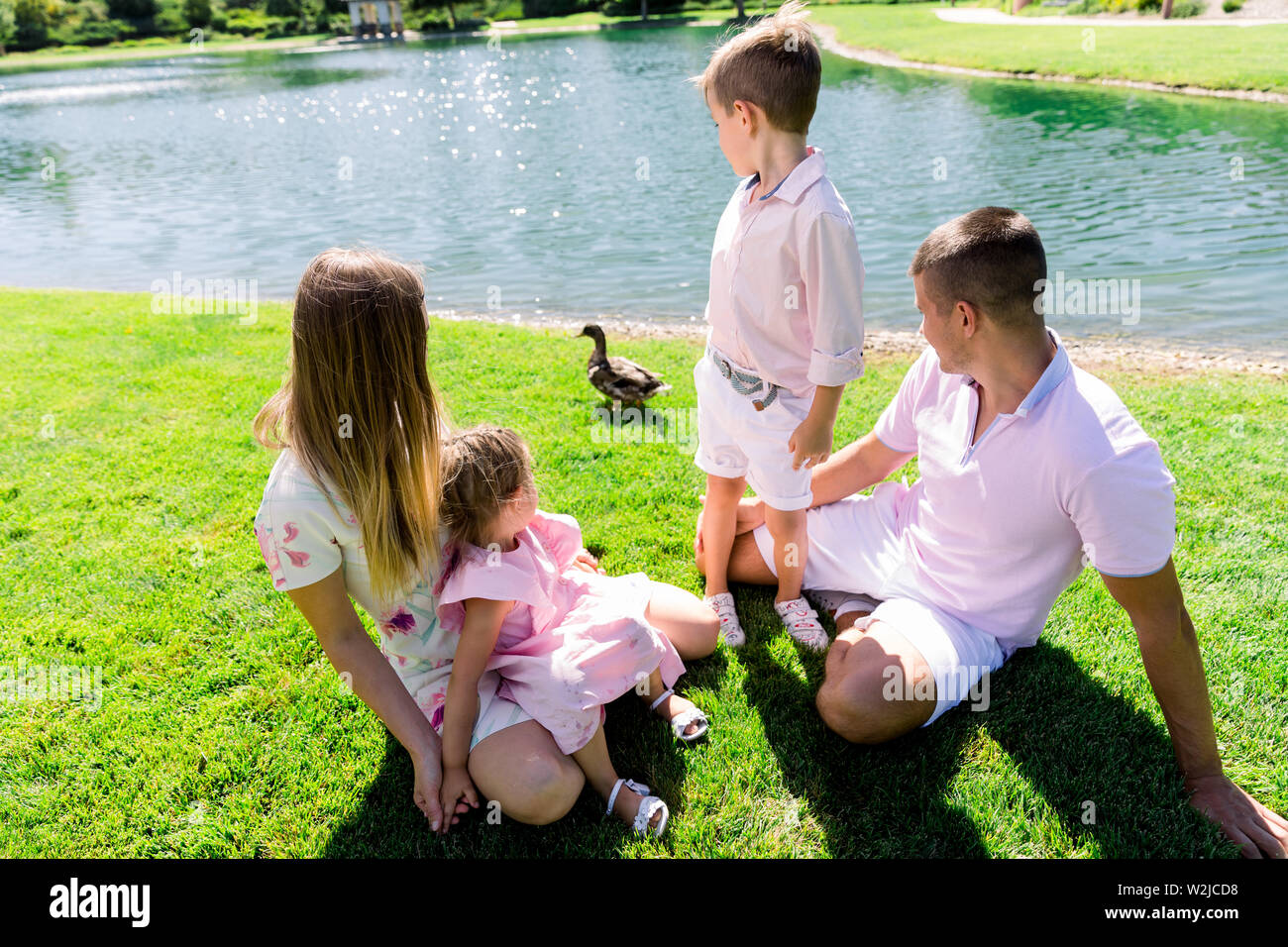 Happy family at the park having a good time together Stock Photo